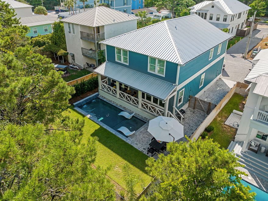 Welcome to your ideal sanctuary in the iconic Seagrove Beach, an exquisitely designed custom home with curated finishes that radiates sophistication and beach living 

This Coastal property comes fully furnished with curated design element. The six-seater golf cart conveys; a two minute ride to the beach access at the Eastern Lake neighborhood beach access. Currently on 360 Blue rental management program and producing solid rental income.

The expansive living area invites effortless entertaining, custom furnishings include: Four Hands Sage Counter Stools and Nuevo chairs. A Worlds Away Dining Table serves as the perfect centerpiece for gatherings, while the Four Seasons Reese Sectional and Miles Chairs provide both comfort and sophistication. Relax around the oversized midnight blue breakfast bar with quartzite and additional seating for large parties at the dining table. The dry bar is stocked with a wine cooler and a cool pop of peacock blue with wall tile! Enjoy the view with multiple windows offering a view of the outdoor oasis.

The pinnacle of the home is the outdoor pool and green space.. Step outside to enjoy your private backyard oasis complete with a heated pool, outdoor showers, and a lush lawn.

The primary is on the main featuring a luxury Bernhardt Axiom Panel King Bed, complemented by a Gabby Chiri Chest and Albany Side. This retreat is enhanced by the warm glow of Gabby Anniston and Regina Andrew Milos Sconces.

The bunk room, featuring four custom built-in twin over full beds accented by a Four Hands Rosedale Dresser and enhanced by delightful Newport Sconces.

The upper bedrooms boasts a Four Hands Beds alongside a stylish Allegra Dresser and Delilah Nightstands, all accented by chic glass lamps, creating an elevated luxury vibe.

A vibrant Gabby Clara King Bed in Plush Mustard, matched with a sleek Worlds Away Dresser and refined Gabby Navy Drink Tables, ensures a dynamic yet comfortable livability. Sectional and Miles XL Chairs provide both comfort and sophistication.

Designed with energy efficiency in mind, this exceptional home features a durable block foundation and advanced insulation for soundproofing.

There is ample parking with five spaces and cruiser bikes. Take an evening stroll to Greenway Station or ride over to Seaside and Watercolor in you six seater golf cart to enjoy all of the entertainment and dining choices.