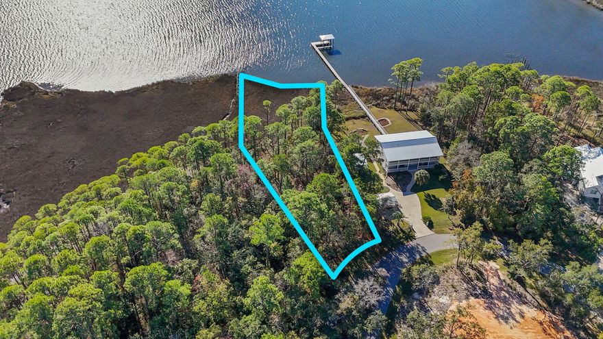 Waterfront land for sale on LaGrange Bayou in Freeport, Florida! Escape big city life and build your dream coastal retreat on this approximately .87-acre bayfront homesite, one of only a few lots in the neighborhood with ownership extending into the conservation area, offering the potential ability to obtain permits for a private boat dock. With access to Choctawhatchee Bay, this Florida waterfront property is ideal for buyers searching for a boating lifestyle near Destin and 30A. Cruise to Crab Island and Destin Harbor in approximately 20 minutes depending on boat speed and conditions, fish from your backyard, or enjoy paddleboarding and coastal living along the Emerald Coast. This wooded lot will need to be cleared. No HOA fees, only community CC&Rs designed to preserve the neighborhood character with site-built homes only, a maximum two-story height restriction, and no RVs or mobile homes permitted. Perfect for a custom home, second home, waterfront retreat, or investment opportunity in Freeport FL. Come live the quiet waterfront lifestyle only minutes from 30A and the Emerald Coast beaches. *Survey available.* Rare opportunity to own one of the limited bayou-front lots in the neighborhood with conservation ownership extending toward the water, offering potential private dock permitting opportunities subject to buyer verification and approvals. Convenient access to Freeport, 30A, Destin Harbor, public boat launches, waterfront dining, and Emerald Coast recreation. Attractive option for buyers relocating from Atlanta, Nashville, Dallas, Houston, Birmingham, and other growing metro areas seeking more space, privacy, boating access, and a relaxed coastal lifestyle. Site-built homes only per recorded CC&Rs. Buyer to verify feasibility, dimensions, land use, environmental requirements, dock permitting, setbacks, and all information deemed important.