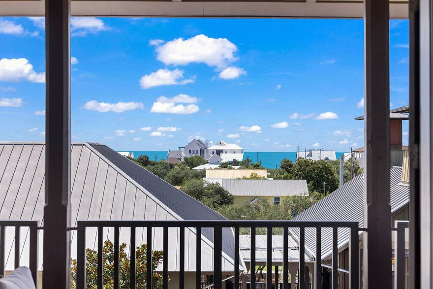 Rare top-floor corner residence in the highly sought-after Redfish Village M1 building, featuring the largest floor plan in the community and beautiful Gulf views. This spacious 3BR/3BA retreat offers high ceilings, newer LVP flooring, granite countertops, mosaic tile backsplash, and a large kitchen island with bar seating perfect for gathering. The dual-access balcony welcomes coastal breezes and captures views toward the Gulf and surrounding Blue Mountain Beach area. A thoughtfully designed quad bunk room maximizes guest capacity and rental flexibility. Offered fully furnished with strong rental potential. Owners enjoy private deeded beach access with seasonal shuttle, resort-style pool, fitness center, theater room, playground, lake boardwalk, & grilling areas.