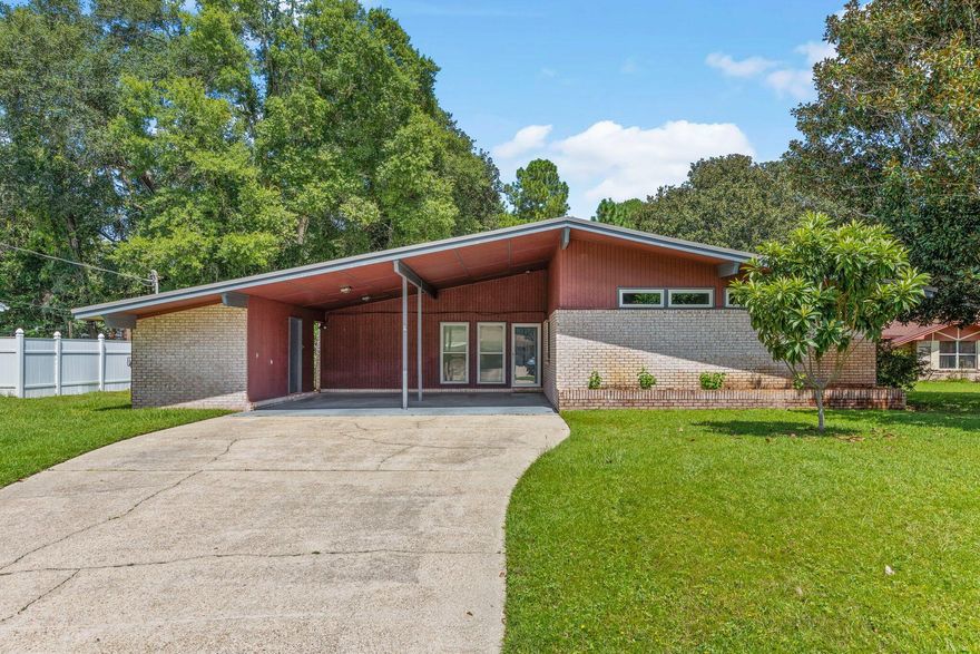 This beautifully updated mid-century modern home blends timeless character with modern features. Warm, inviting, and filled with natural light, this one-of-a-kind property offers a perfect balance of charm and comfort. Picture gathering with friends in the spacious great room, unwinding in the stylishly renovated primary bath with a sleek tiled shower, or enjoying your favorite drink from the comfort of your screened porch as the sun sets.

Situated in the heart of Niceville, the home is conveniently close to top-rated schools, shopping, dining, and offers easy access to Destin, Fort Walton Beach, and Eglin Air Force Base, along with major routes connecting you across Northwest Florida.

Inside, you'll find a bright and airy living space with high ceilings and an abundance of natural light. The open-concept design flows effortlessly into an inviting eat-in kitchen, ideal for entertaining. A spacious den provides additional room to relax or host guests.

Enjoy peaceful mornings in the generous Florida room and take advantage of the large backyard--perfect for outdoor living and entertaining. Schedule your showing today and experience everything this exceptional home has to offer!