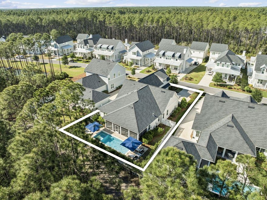 Positioned in the highly sought-after Greenway phase of WaterSound Origins, this custom-built Huff home offers a rare combination of privacy, functionality, and move-in-ready convenience. Ideally located at the front of the neighborhood for quick access to Highway 98, the property sits on a quiet street with no future construction and backs to a protected wooded preserve--ensuring long-term privacy.
This thoughtfully designed 5-bedroom residence features a unique and versatile layout. A standout feature is the private 5th BEDROOM SUITE above the garage, complete with kitchenette (beverage refrigerator, sink, and microwave), full bath, and a separate door at the top of the stairs for added privacy. With interior access (no exterior stairs), it's ideal for an in-law suite, college student, au pair, college student, or dedicated office.
The main level includes four bedrooms, with a split floor plan that places the primary suite at the rear of the home for maximum privacy. The primary offers abundant natural light, a spa-like bath with dual vanities, soaking tub, walk-in shower, and a custom-built closet system. At the front of the home, two bedrooms share a full bath, while a third oversized bedroom features its own en suite and walk-in closet.
The chef's kitchen is designed for both daily living and entertaining, highlighted by a large center island with seating for four, extensive cabinetry with upper lighting, and a spacious walk-in pantry. Premium appliances include a 36" WOLF range, Sub-Zero built-in refrigerator, and Sharp microwave drawer. The open-concept living area is expansive and filled with natural light, anchored by a gas fireplace.
Additional highlights include an oversized laundry room with ample storage and a seamless transition to the outdoor living space. The backyard is a true retreat, featuring a full-width screened porch with , multiple seating and dining areas, and an oversized pool and spa with sun ledge. A gas stub is in place for a future outdoor kitchen, and the preserve setting ensures exceptional privacy.
Offered furnished with Restoration Hardware pieces NEGOTIABLE, this home presents a turnkey opportunity--without the wait to build.