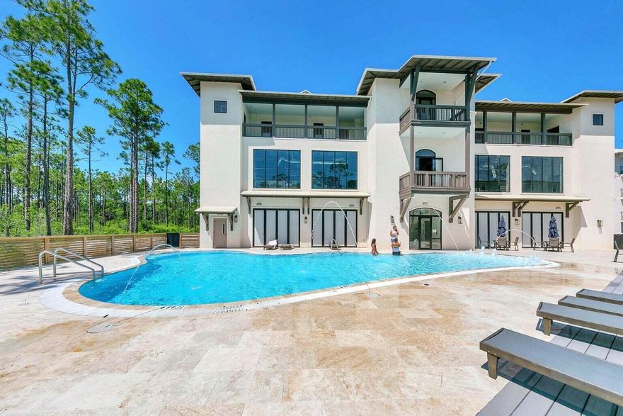 Welcome to 30A -- one of the newest and most desirable condominium communities near the beach. Unit 341 is a rare opportunity to own the largest one-bedroom deluxe floor plan in the community, ideally positioned on the peaceful top fourth floor with private balcony views overlooking nature and surrounding greenery.

Built in 2022 with remarkable craftsmanship and upscale finishes throughout, this beautifully maintained condo feels more like a boutique luxury retreat than a vacation rental. The current owner has meticulously cared for the property, using it primarily for family and close friends, resulting in a unit that remains in exceptional condition with very light rental use.

Inside, you'll immediately notice the thoughtful layout and elevated design details. Unlike many one-bedroom condos, this floor plan offers a more private entryway before opening into the spacious kitchen and living area. The unit features 9-foot ceilings, smooth white walls, abundant natural lighting, designer wallpaper accents, shiplap details, and high-end luxury vinyl plank flooring throughout with absolutely no carpet. The kitchen is both functional and stylish, complete with quartz countertops, oversized bar seating, stainless steel appliances, and recently updated dishware with elegant honey-gold flatware accents. The comfortable living room has been thoughtfully curated with quality furnishings, including a newly replaced high-end wool rug and two smart TVs that convey with the sale.

The oversized primary suite offers a true luxury feel with boutique-quality real wood furniture, upscale décor, and a premium Purple mattress. A cozy sitting area with double blue accent chairs creates the perfect reading nook, office space, or quiet lounge area. The oversized walk-in closet is so spacious it could practically accommodate a twin bed. The bathroom features a beautifully tiled deep soaker tub and shower combination, creating a spa-like atmosphere for owners and guests alike.

Additional features include a stackable washer and dryer that also convey, ample storage throughout, and oversized countertop seating ideal for entertaining. At just under 900 square feet, this is the largest one-bedroom deluxe model offered within the community.

Pinewoods on 30A offers resort-style amenities including open parking, a large community pool, oversized hot tub, fitness center with full equipment, and upscale locker room facilities. Located only about a mile from beach access, owners and guests love the convenience of being close to boutique shopping, incredible chef-inspired restaurants, and scenic bike routes. One of the area's favorite ways to explore 30A is by renting the popular motorized bikes, making trips to the beach and local attractions effortless and enjoyable.

Vacation bookings are currently in place and can transfer to the new owner at closing, offering immediate income potential, or alternative arrangements can be made for buyers seeking a primary residence or second home. 

And let's talk about the signature scent! The home has a light coastal scent, made by northern lights. The scent is "seagrass & aloe" and it is heavenly. Many spas and boutiques use the scent, and the owner selected this high-end designer oil for the unit. 

Unit 341, located in Building 3 on the far-right side of the community, offers a quiet top-floor location combined with luxury finishes, modern construction, and unbeatable proximity to the beach. Offered at an attractive price point for the smart and savvy buyer looking to secure one of 30A's best values.
