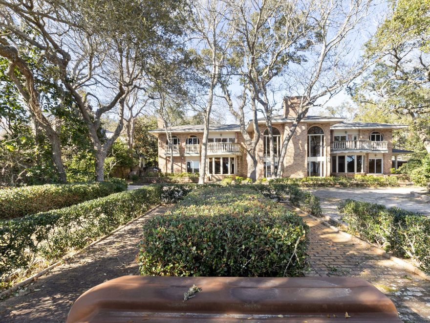 Tucked away on 2.75 acres along the Santa Rosa Sound, this stately and captivating waterfront estate offers an extraordinary combination of privacy, deep water access and enchanting views of the barrier islands and the gulf. A 600-foot oak-lined driveway leads to this impressive 5,120-square-foot Old Chicago brick home, where timeless elegance and quiet charm meet the beauty of the Intracoastal Waterway.  

With 150 feet of private sandy beach and deep water frontage, this property provides unparalleled access to the water. Whether launching a kayak, paddleboard or jet ski right from your backyard or simply being enthralled by the serenity of the water from the verandas, this is a retreat like no other.