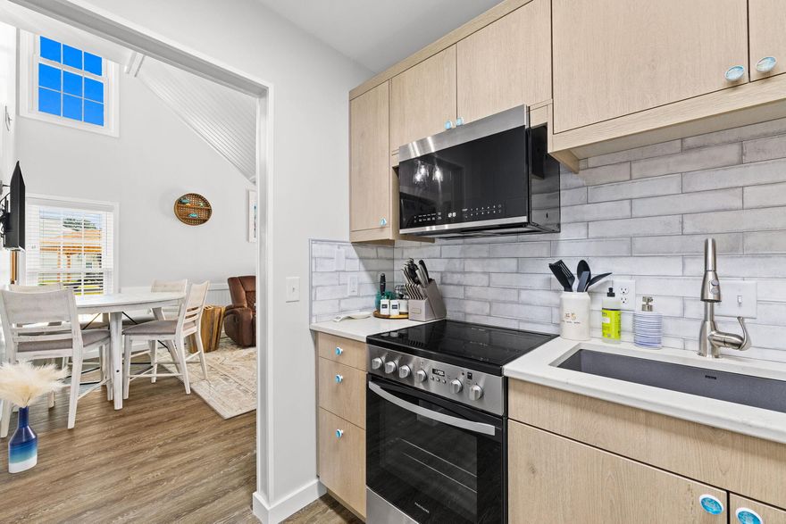 THIS IS THE ONE THAT TRULY STANDS APART!! Among similar units currently available, this fully renovated 2 bed, 2 bath condo showcases higher quality finishes, thoughtful upgrades, and meticulous care throughout. This spacious unit features soaring ceilings and abundant natural light in the living area, with an interior staircase leading to the 2nd floor bedroom. The beautifully updated kitchen offers wood cabinetry, stylish backsplash, large quartz farm sink, and new appliances, complemented by upgraded bathrooms with tile showers and LVP flooring throughout. Enjoy your own private courtyard along with resort style amenities including multiple pools, hot tub, pickleball, putt putt, fitness center, and game room. Just a short stroll to the stunning white sand beaches of PCB.  Call today!!