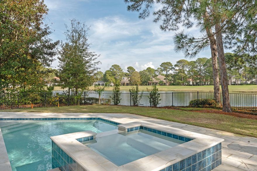 PRICED TO SELL !!! BURNT PINE  4 BEDROOM 3.5 Bath HOME SITTING ON NEARLY A 1/2 ACRE LAKEFRONT LOT ON THE BURNT PINE GOLF COURSE AT SANDESTIN GOLF AND BEACH RESORT. As you Enter the Home there is a Dramatic 2 Story Living Area with Wall to Wall Windows Overlooking the Pool, Lake and Golf Course.  A PRIVATE  MAIN Bedroom is located on the First Floor with 2 Large Walk In Closets and Remodeled Bath with Walk in Shower and Tub. 
First Floor Also has a 2nd Bedroom with Private Bath and Office. Kitchen has an Oversized Island and Wine Cellar. Off the Kitchen is a Dining Room, Wet Bar and Keeping Room with a Stacked Stone Fireplace. Upstairs has 2 bedrooms, Full Bath and a Bonus Room. Large Screened Porch with Summer Kitchen & 3 Car Garage. NEW ROOF IN 2022, POOL & SPA IN 2023.