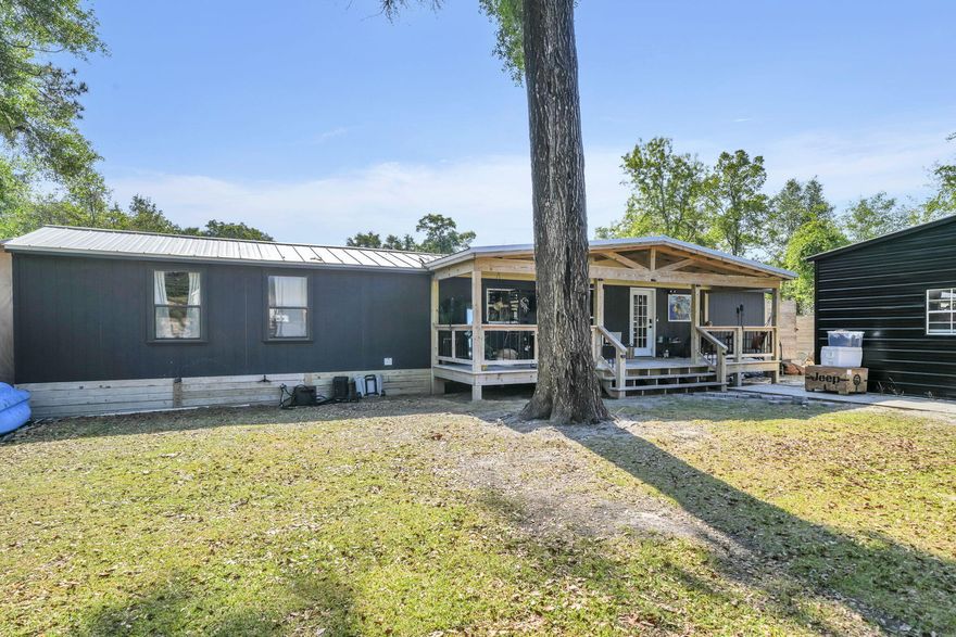 Move-in ready home in growing Freeport, close to the Black Creek boat ramp and just a short drive to the beautiful beaches of South Walton. This home features vaulted ceilings, beautiful Pergo and hardy pine flooring, recessed lighting in the kitchen and living room, and a spacious custom kitchen with Samsung appliances, a copper farmhouse sink, and plenty of cabinet space.

The primary bathroom includes a granite countertop and walk-in shower. The home has been freshly painted inside and out, updated straps and tie-downs, plus all-new skirting.

Enjoy outdoor living with both front and back porches, and a completely fenced yard offering privacy and space for pets or entertaining. Additional features include a shed converted into an office and a garage/warehouse space for storage.