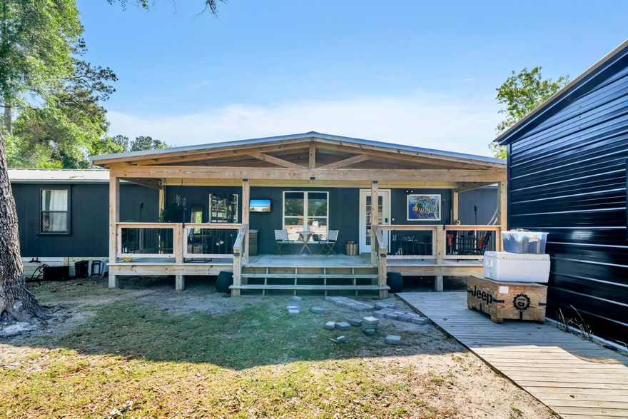 Move-in ready home in growing Freeport, close to the Black Creek boat ramp and just a short drive to the beautiful beaches of South Walton. This home features vaulted ceilings, beautiful Pergo and hardy pine flooring, recessed lighting in the kitchen and living room, and a spacious custom kitchen with Samsung appliances, a copper farmhouse sink, and plenty of cabinet space.

The primary bathroom includes a granite countertop and walk-in shower. The home has been freshly painted inside and out, updated straps and tie-downs, plus all-new skirting.

Enjoy outdoor living with both front and back porches, and a completely fenced yard offering privacy and space for pets or entertaining. Additional features include a shed converted into an office and a garage/warehouse space for storage.