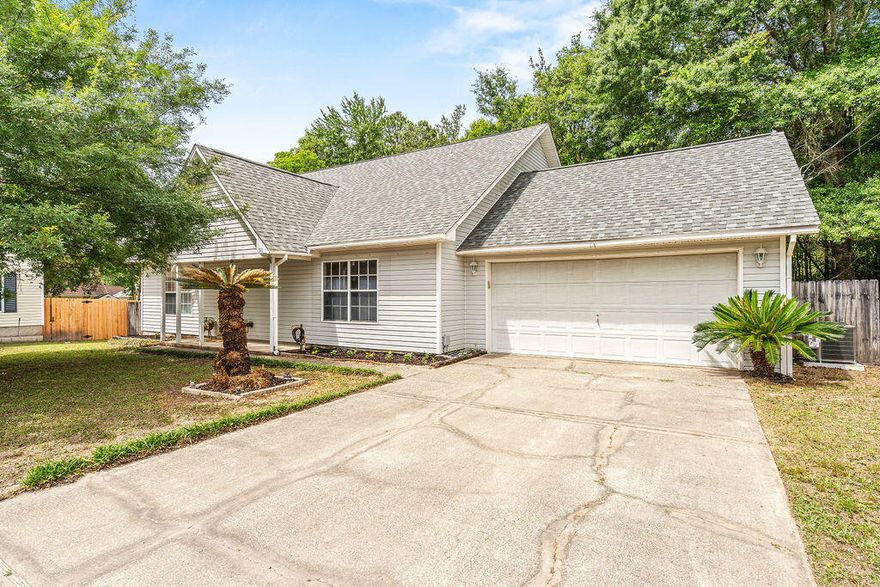 Tucked away in a quiet cul-de-sac, this inviting home offers comfort and convenience just minutes from restaurants, shopping, schools, and military bases. Inside, you'll find a bright open living area with vaulted ceilings and wood-look vinyl flooring. The spacious kitchen features ample cabinet space, a pantry, and tile flooring. The split floor plan provides added privacy with the primary suite located downstairs and featuring a double vanity in the en-suite bath. Secondary bedrooms are carpeted for comfort, while the main living areas are low-maintenance and stylish. Enjoy relaxing or entertaining on the backyard deck. Major updates include a new roof installed in July 2020 and a water heater replaced in 2021. Call today!