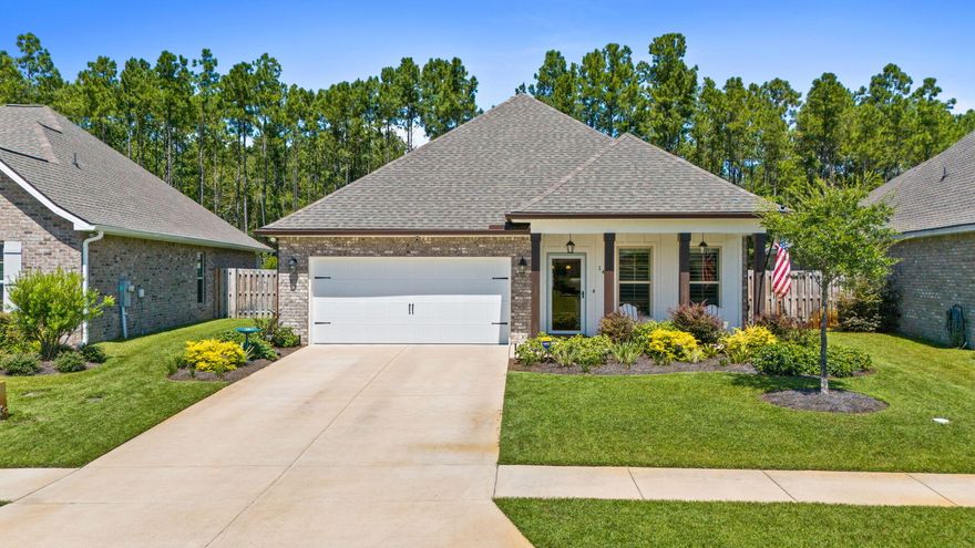 Only 22 mins to 30A beaches, 14 Cozy Cove is located in the highly sought neighborhood of Hammock Bay! Stellar 4/2 floor plan w/ great room, offers the perfect blend of modern upgrades and coastal comfort. Screened porch, extended patio, fenced backyard and shed back to a private Nature Preserve of beautiful trees. Large front porch leads to an open, inviting floor plan with abundant natural light, spacious living room, and dining with stylish shiplap accents & plantation shutters. Chef's Kitchen has stainless appliances, large island, quartz countertops & huge pantry with wood shelving. Every detail blends to create the perfect, move-in ready lifestyle! Hammock Bay is a premier master-planned community offering resort-style amenities including Creekside Clubhouse w/  ming pool, fitness room, viewing deck, pickle ball, basketball.  Additionally, Windmills Town Center (10 minute drive) also has three swimming pools, 8,000 SF fitness center, owners' club with indoor/outdoor entertaining space, tv room, theatre, caterer's kitchen, etc. Blue Mountain Beach and the sugar sand of 30A, along with 32 mile long Choctawhatchee Bay and the Gulf of America await you and your guests. Don't miss this turn-key gem in one of Northwest Florida's most sought after neighborhoods. Schedule your private tour today at 14 Cozy Cove and start living the Florida lifestyle you've always wanted!