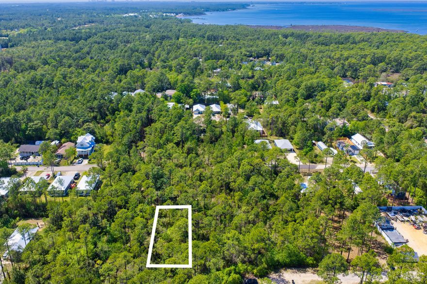A spacious homesite with mature landscaping that would be ideal for a primary residence, vacation home, or an income-generating property. The property is not subject to homeowners association regulations and does not require a build-out period. It is conveniently located near the Cessna Landing boat launch and the restaurants, shops, and beaches of South Walton.