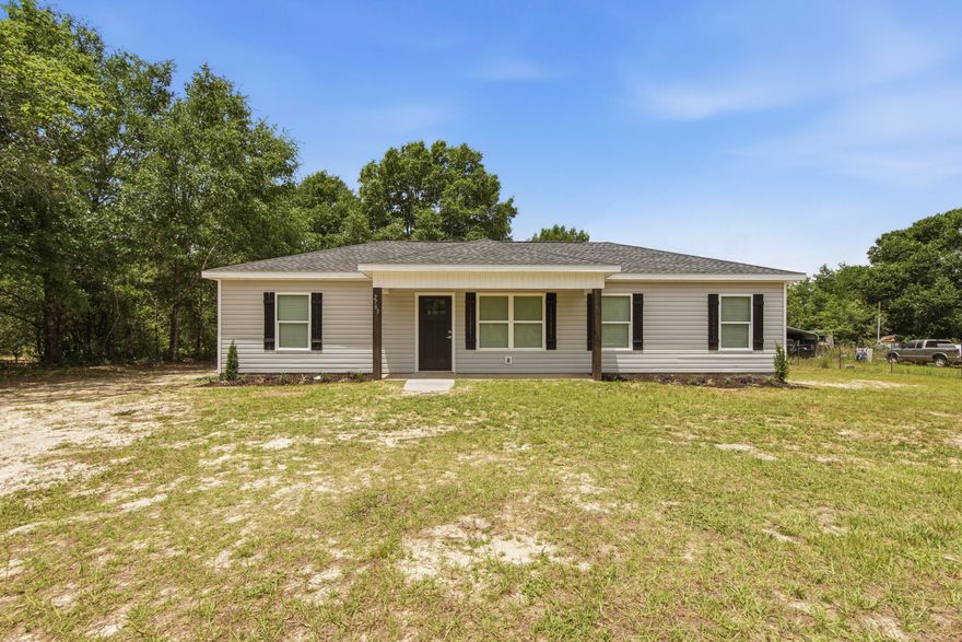 Welcome to 2763 Oak Ridge Road where wide open skies meet everyday comfort.  Nestles on nearly an acre of land in the heart of the Florida panhandle, this well built 2008 home offers four bedrooms with a split floor plan, two full baths across 1200 square feet of easy, efficient living.
The .78 acre lot gives you room to breathe, garden, add outbuildings, or simply enjoy the quiet of country life while staying connected to everything DeFuniak Springs has to offer, a charming historic downtown, local dining, easy I-10 access, and less than an hour's drive to the sugar white sands of the Emerald Coast.
What truly sets this property apart is the metal hangar, a rare and highly versatile structure perfect for hobbyists, contractors, or anyone needing serious workspace.  Whether you are using it for  a boat, a small RV, equipment, or running a home based business, this is the kind of bonus you don't just find at this price point.
All kitchen appliances and washer/dryer convey.
Buyer to verify all information deemed important.