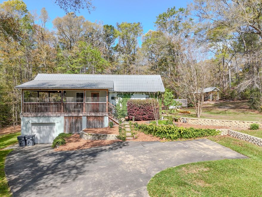 Nestled at 211 Lester Price Rd in Ponce de Leon, this 1,152 sq ft home (built 2004) on 1.73 Acres offers peaceful rural living just minutes from Hwy 81 and Interstate 10. Step inside to find bright, inviting open-concept living spaces with soaring vaulted ceilings and beautiful pine hardwood floors that flow throughout. The well-designed kitchen is a standout, featuring crisp white shaker cabinets, a convenient tiled island, stainless steel sink, and generous natural light pouring in from the oversized window--ideal for everyday meals or entertaining.
The thoughtfully laid-out interior includes a full bathroom with classic pedestal sink, a dedicated laundry room complete with washer/dryer hookups and ample storage, a flexible bedroom, and additional bonus space perfect for a  home office, hobby room, or creative retreat. A huge screened porch with ceiling fan provides the perfect spot to unwind while enjoying views of the lush yard and the charming garden pond with its soothing fountain--wonderful for morning coffee, evening relaxation, or simply soaking in the serene surroundings.
Generac whole-house propane generator ensures reliable power and peace of mind during storms or outages. Outside, you'll appreciate the practical pump house and garden shed offering storage and a workbench, along with a workshop area and UTV-ready space. The full 1.73 wooded acres create endless opportunities for gardening, wildlife observation, outdoor recreation, or future expansion while maintaining wonderful privacy.
Recent updates throughout make this home truly move-in ready. A rare find for nature lovers and those seeking a tranquil country lifestyle with modern comforts. Call today to schedule your private showing and experience the charm for yourself!