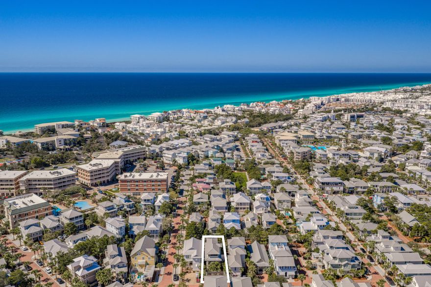 Three-Story Coastal Retreat With Trailside Porches And Strong Rental Appeal

Set along a wooded nature trail just moments from the famed lagoon-style pool, this thoughtfully composed three-story beach home offers the kind of 30A ownership opportunity that feels equally suited to personal escapes and strong investment performance. Known as 'Reset Button,' the residence has been carefully maintained and self-managed by its owners, with annual rental income exceeding $127,000 for each of the past four years. The result is a home with proven appeal, generous gathering spaces, and a distinctly personal point of view.

Inside, approximately 2,500 square feet unfold with natural pine wood flooring, abundant windows, and an open floor plan designed for easy connection. The kitchen is both functional and inviting, appointed with stainless steel appliances, pendant lighting, and a large island with counter seating. Just beyond, the dining and living areas create an easy rhythm for entertaining, family meals, and relaxed evenings after the beach. The interiors strike a rare balance: polished yet comfortable, stylish yet unfussy, with original artwork by Alyson Wickey that adds character and a sense of place.

The five-bedroom, four-bath layout offers exceptional flexibility for larger groups. A first-floor guest suite opens to a private porch and sits near the main living areas for convenience. On the second level, the primary suite enjoys its own balcony and a spacious bath with soaking tub and marble countertops. Two bunk rooms on this floor add versatility for family use, while a full hall bath and dedicated laundry area enhance everyday livability. The entire third floor functions as an expansive suite with a wet bar, full bath, office area, and access to two oversized porches that extend the living experience even further.

Outdoor spaces are a defining feature here, with six porches and balconies offering quiet corners for coffee, conversation, afternoon reading, or evening cocktails beneath the coastal sky. The rear yard, positioned along the walking trail, adds another layer of privacy and charm, with room to grill, dine, and gather around the fire pit.

Located in Seacrest Beach along Scenic Highway 30A, the home enjoys access to one of the area's most sought-after amenities: the 12,000-square-foot resort-style lagoon pool, along with convenient tram service to the beach. Positioned on the Rosemary Beach side of Seacrest, it is also close to shopping, dining, and the white-sand shoreline that makes this stretch of the coast so beloved. With its strong income history, distinctive personality, and highly livable layout, this property offers far more than a place to stay; it is a home people return to again and again.