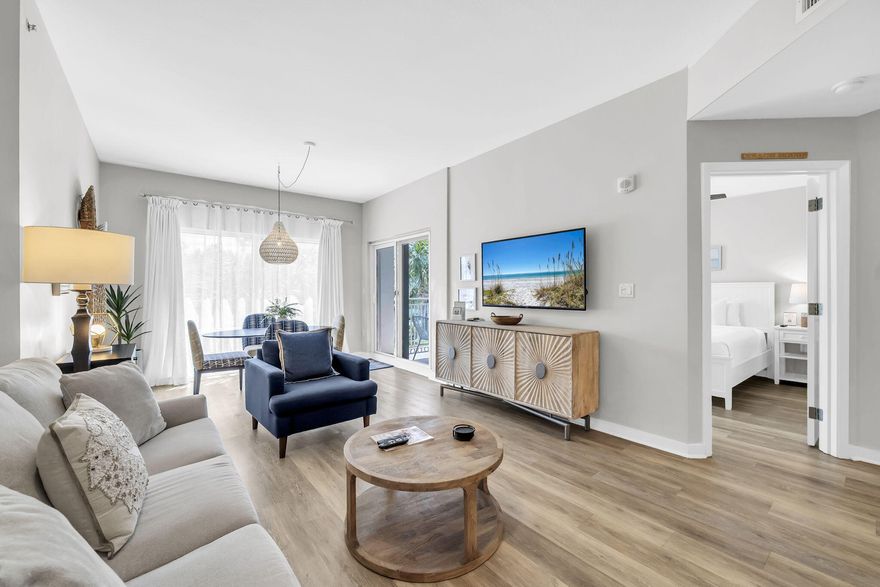 Designer-decorated and beautifully updated 1BR/1BA elevated 1st-floor unit with serene tropical views from floor-to-ceiling windows and doors out to a spacious balcony. Ideally positioned near the fitness center, pool, and main entrance of Luau II for unmatched convenience. Spacious, open layout offers dual-bathroom access from both the living area and the primary bedroom. Fully furnished and truly turnkey, making it perfect for immediate rental income or a hassle-free personal getaway. Enjoy resort-style living with amenities including a heated pool, cascading waterfall, hot tub, grilling area, rooftop sundeck with sweeping views, and a well-equipped fitness center. A sought-after coastal retreat with exceptional rental potential and strong guest appeal. Sandestin Golf and Beach Resort features more than seven miles of beaches and pristine bay front, four championship golf courses, 15 world-class tennis courts, a 226-slip marina, a fitness center, spa and celebrity chef dining. Shop, dine and play at the charming pedestrian village, The Village of Baytowne Wharf and more. Inside the gates of the resort, residents enjoy a balanced lifestyle of high-class living, spanning the 2,400 acres from the beach to the bay. Everything within the gates of the resort is accessible by golf cart or bicycle. The entire resort is interconnected by miles of pedestrian, bike, and golf-cart paths that weave through groves of live oaks, meandering past natural lagoons, fountains, man-made lakes, and meticulously landscaped fairways.