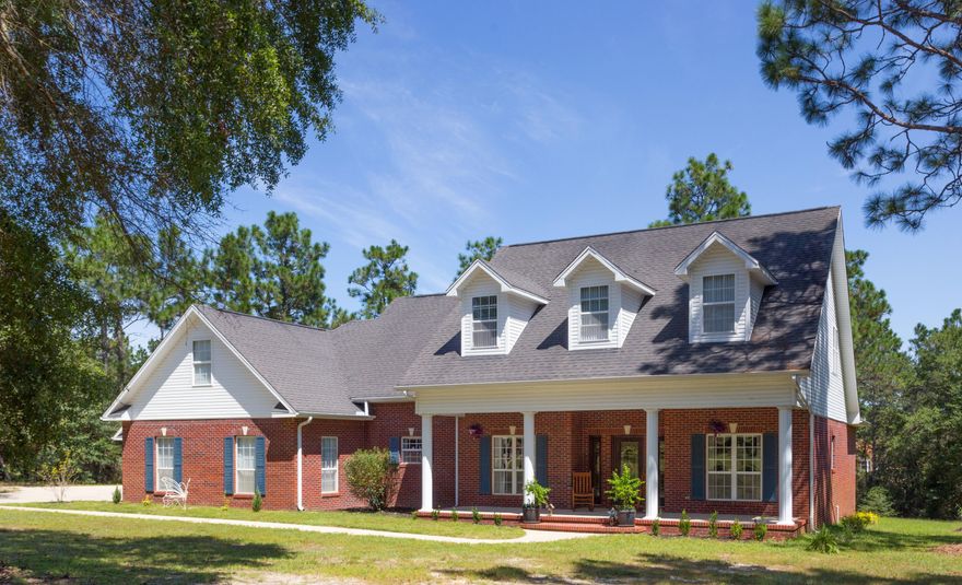 Enjoy the serenity of the lake and nearly 2 acres of privacy surrounding the home with established trees. This home has 2 oversized garages. Seller has completed multiple upgrades which include adding heated/cooled square footage in the finished 2 story detached garage w/bonus room with its own central a/c, half bath, and septic. Kitchen upgrades include new granite countertops, stainless steel sink, brushed nickel faucet. Granite added in office nook & laundry room. Two new custom bathroom counters, new fixtures & hardware in all bathrooms, freshly painted in modern warm & cool tones. New motors in both garages for quiet and smooth operation. Survey, Washer/Dryer included. Hook up for gas stove is in place. Both septic tanks emptied & inspected 2 yrs ago. New plumbing boots on roof.