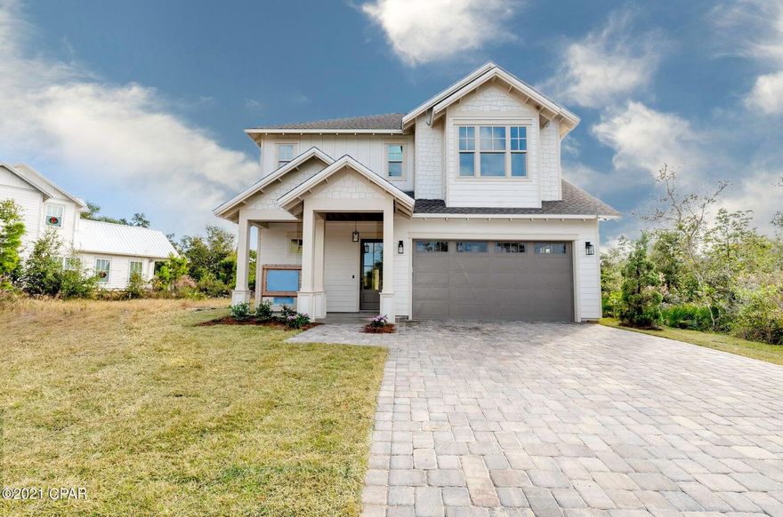 LOWEST PRICED PER SQUARE FOOT CUSTOM HOME IN SANCTUARY BEACH!

Beautifully crafted and impeccably maintained, this 4-bedroom Craftsman home in the highly sought-after Sanctuary Beach subdivision offers the perfect blend of timeless design, modern upgrades, and coastal convenience. Move-in ready and thoughtfully enhanced throughout, this residence delivers both comfort and sophistication in a serene, wooded setting. Ideally positioned within the community, the home is just moments from the neighborhood pool and approximately ¼ mile to the nearest beach access, making it easy to enjoy the best of the Emerald Coast lifestyle.

Inside, the open-concept floor plan is filled with natural light and elevated by white oak flooring, soaring ceilings, and expansive windows. The chef's kitchen is a true centerpiece, featuring white cabinetry, marble countertops, a shiplap and cedar backsplash, breakfast bar, upgraded stainless steel appliances, and a ZLINE commercial-grade range with six gas burners, electric oven, and vent hood. A spacious butler's pantry adds both function and style.

The main living and dining areas are designed for effortless entertaining, highlighted by a vaulted ceiling and 8-foot folding French doors that open to an oversized patio and backyard perfect for seamless indoor-outdoor living.

The main-level primary suite offers a private retreat, complete with reclaimed 9-foot barn doors, a spa-inspired bathroom with marble flooring, a large glass-enclosed shower, double vanities, a freestanding soaking tub, and an expansive custom walk-in closet.

Upstairs, you'll find three generously sized bedrooms, a full bath with tiled tub/shower and double vanity, and a spacious laundry room with additional storage and natural light. A convenient powder room is located on the main floor for guests.

Additional features include full insulation of all interior and exterior walls, blown-in ceiling insulation for enhanced energy efficiency, a paver driveway, and an attached two-car garage.

Located near a Jack Nicklaus-designed golf course, multiple marinas, St. Andrews State Park, and an array of dining and entertainment options, this home offers both tranquility and accessibility.

This exceptional property captures the essence of Sanctuary Beach living, schedule your private showing today.