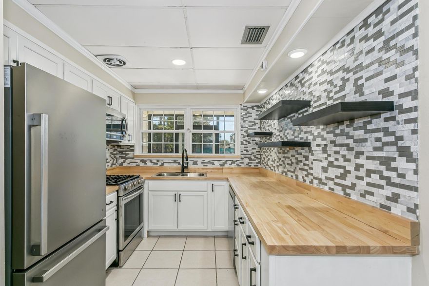 Open House: Saturday 05/16 (12-3 PM). Great opportunity to own a move-in ready home in the heart of Fort Walton Beach, minutes from the beaches of Okaloosa, this home offering a spacious 4-bedroom layout ideal for home office or guests.. Conveniently located near shopping, dining, and just minutes from the beautiful beaches of Okaloosa Island and Destin. Close to Eglin Air Force Base and Hurlburt Field. Major updates include waterproof LVP flooring with transferable warranty, fresh neutral paint, and new trim throughout. The updated kitchen features white cabinets, butcher block countertops, backsplash, and stainless refrigerator. Additional improvements include new electrical panel, updated wiring, recessed lighting, and smart ceiling fans.