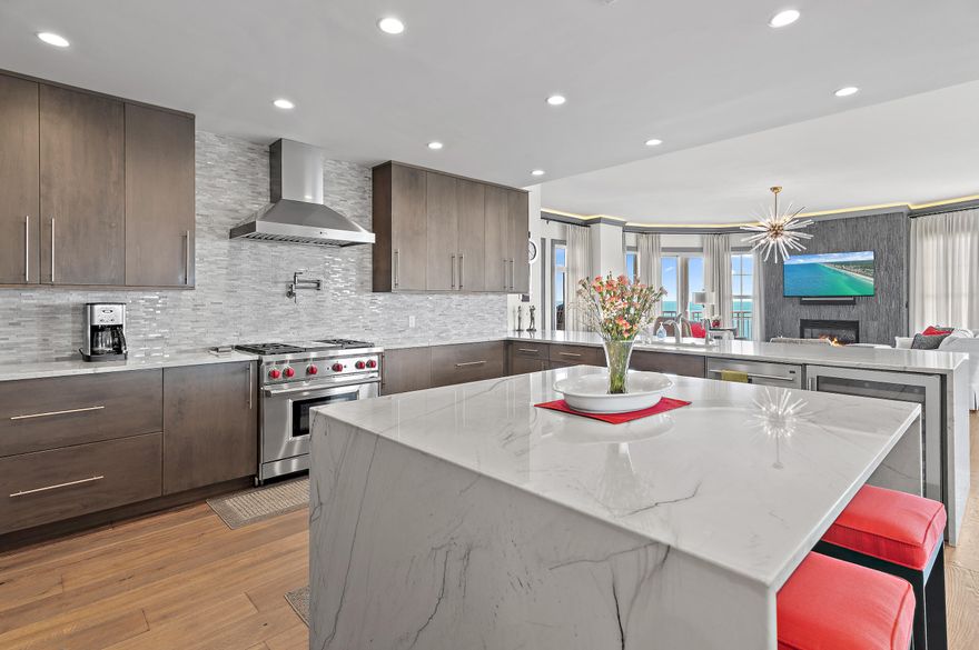 The only fully renovated Castleton at OWP has officially come to market.  Experience unparalleled luxury in this fully renovated Castleton unit #1503 at One Water Place! Every detail has been thoughtfully upgraded, including new hardwood floors throughout, designer tile in the entry, laundry, all bathrooms, and fresh paint on walls, ceilings, and trim. Custom draperies and modern light fixtures enhance the ambiance.
The gourmet kitchen showcases a complete redesign with expanded space, custom cabinetry, Wolf and Sub-Zero appliances, a wine cooler, and a stunning tile backsplash. The master suite features an expanded walk-in closet, spa-like bath with a larger shower, soaking tub, dual vanities, and custom cabinets. Both guest bedrooms offer new showers, vanities, and upscale fixtures. Additional highlights: columns removed for an open feel, widened office entry with built-in desk and cabinets, sliding doors added to laundry and baths, and a den with a new stone fireplace surround. Enjoy resort amenities, including a pool, fitness center, golf simulator, and 24/7 concierge. Located in coveted Kelly Plantation, minutes to beaches, shopping, and dining. Move-in ready for the most discerning buyer!