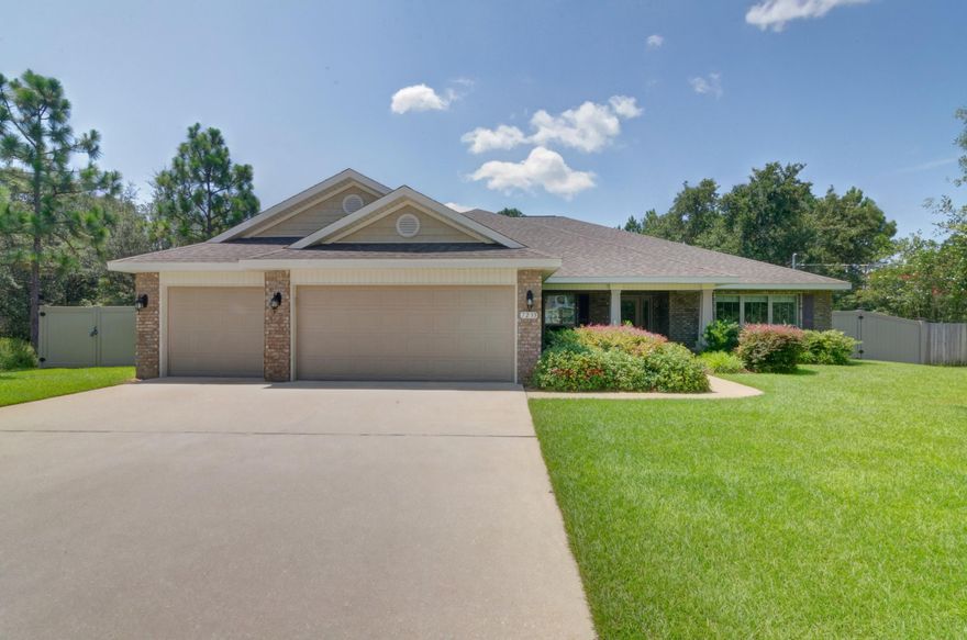 Welcome Home to your simply Gorgeous, LIKE NEW ~ 4 BEDROOM/3 FULL BATHROOM split floor plan home 3000 sq. ft. of true family living space. Welcomed by pleasing curb appeal,with manicured yard and landscaping enhanced by a beautiful oak tree~huge driveway, 3 car garage/ long undercover Craftsman Style front porch sets the stage for this home~exquisite inside and out. Greeted by high ceilings ~ tiled foyer/open flow to the huge Great room with surround sound speakers and decorative plant ledge~separate dining area,breakfast nook and kitchen / tiled in beautiful rich 18 x 18 porcelain tile~kitchen with granite counter tops,walk in pantry,S/S appliances, built in microwave,DOUBLE OVEN & smooth glass cooktop,Large Center Island, under /over cabinet lighting,breakfast bar & breakfast nook to relax in a morning viewing the back patio and garden.All this great family living space and still with a large office/den ~ Master bedroom with trey ceiling & door out to the covered patio/Master bath has his and hers cultured marble sink areas, step in garden tub, oversized separate walk in tile shower/ double shower heads /private WC. All additional bedrooms are a great size with large closets and ceiling fans. Two bedrooms share a hallway and access to the additional full bathroom with cultured marble vanity, shower/tub~with access to the back garden (great when entertaining or bathroom access for your future pool) The 4th bedroom would also make a great guestroom being separate from the other bedrooms and enjoys its own large full bathroom. Home sits on a large lot 100 x 200~ Gorgeous back garden is private, fully fenced with superior vinyl fence panels ~double gate access /great back yard storage for your boat or jet skis. Mature oak tree for shade and recently planted fruit trees. Covered porch to grill out and enjoy those wonderful Florida evenings.... Driveway is extended to the full width of the 3 car garage with pull down attic access stairs,for additional loft storage space,and remote garage door openers. Home is all brick exterior and is also fitted with fabric shield storm protection shutters for the exterior and wonderful custom window blinds on all the interior,family room and breakfast area are remote-controlled .Storm protection shutters and 2x6 exterior walls all a great advantage to lower utilities and insurance.Situated on a quiet off road in HBTS this home is a perfect location for your new family home ,close to the gorgeous white beaches on the Gulf of Mexico ,local stores and a short distance to Hurlburt AFB ....call today for a private viewing