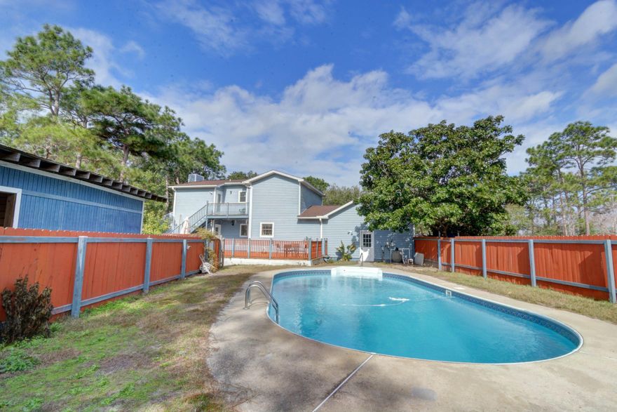 Don't miss this rare opportunity to own a charming equestrian property in East Navarre with it's own beautiful in ground salt water swimming pool and a two year old roof! Live the county life on your own full acre just minutes away from city conveniences and just three miles away from beautiful Navarre beach! The property offers well irrigation, a three stall barn, room for chickens, a smaller pony enclosure, and a large fenced in area for horses. The wrap around porch greets you at the front door, and inside you'll find hardwood floors and the master bedroom (with an antique fireplace!) downstairs, as well as a large kitchen overlooking the back of the property. Upstairs on either side of the large landing are two large bedrooms that share a jack and jill bathroom, and a HIDDEN BONUS ROOM perfect for a playroom, office, craft room, etc. The bonus room is tucked behind the closet in one of the bedrooms, and it has a door leading out to the upper check with a birds eye view of the entire property. Outside this home continues to shine with a massive back porch, a backyard (separate from the fenced area for horses) with a treehouse, and of course the stunning in ground salt water swimming pool that's perfect for enjoying the Florida sunshine or after riding your horses! Be sure to see the attached seller's property disclosure for a complete list of the LONG list of seller updates that will make this home move in ready and give any buyer peace of mind! (home insurance quote found under documents at just $1475/year)