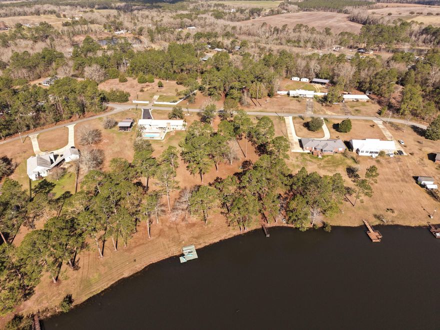 Lot 7, 10 Lakes Drive in DeFuniak Springs offers nearly one acre of beautiful lakefront property, providing the perfect setting for your custom dream home. Enjoy peaceful water views, fishing, kayaking, and relaxing sunsets right from your backyard. The generous lot size allows room for a spacious home and outdoor living areas while maintaining privacy. Located in Flood Zone X for added peace of mind, this property combines waterfront living with convenience to town amenities. A rare opportunity to own just under an acre on the water--bring your builder and start planning your lakefront retreat today. Discover the perfect blend of privacy and waterfront living at Lot 7, 10 Lakes Drive in DeFuniak Springs. This beautiful lakefront homesite is just under one acre, offering ample space to build your custom dream home while enjoying peaceful, natural surroundings. With direct water frontage, you'll wake up to serene lake views and enjoy fishing, kayaking, or simply relaxing by the shore right from your backyard. The generous lot size provides flexibility for a spacious home, outdoor living areas, and room to spread out. Located in Flood Zone X, this property offers added peace of mind while still enjoying true lakefront living. Nestled in a quiet setting yet conveniently located to town amenities, this rare opportunity combines tranquility, space, and water views -- bring your builder and start planning your lakefront retreat today.