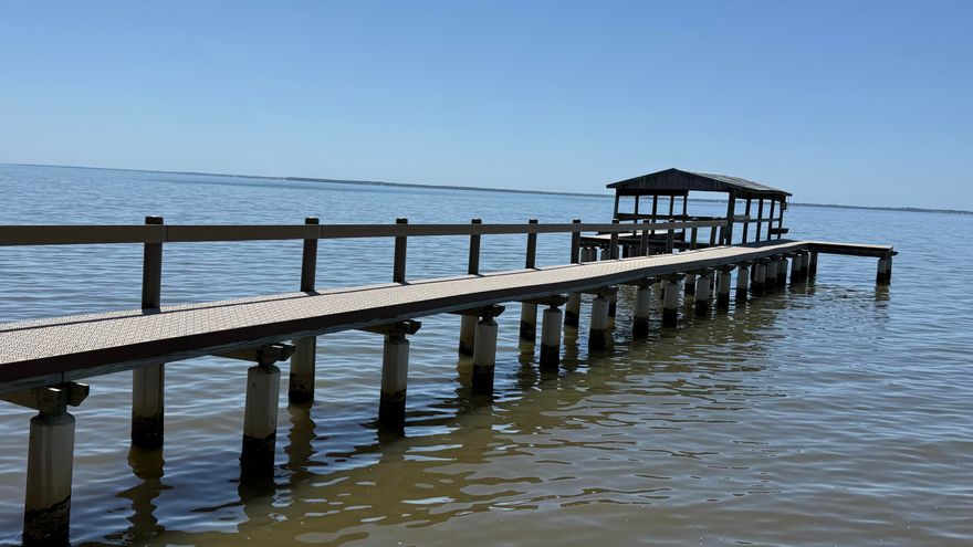 Waterfront living at its finest! This 3BR/3BA home offers 3,276 sq ft on 0.80 acres with stunning bay views and private mother-in-law suite with separate entrance, kitchenette, and en suite bath--ideal for guests or rental potential. Features include cathedral ceilings, skylights, spacious living areas, and a bright sunroom overlooking the water. The kitchen boasts stainless and black appliances; center island includes Jenn-Air smooth top stove and breakfast bar. The master suite features a whirlpool tub, separate shower, and walk-in closet. Enjoy outdoor living with a raised seawall and beautifully rebuilt dock. Additional highlights include metal roof, 2-car garage, and hurricane shutters. A rare opportunity for serene coastal living in Freeport, FL!