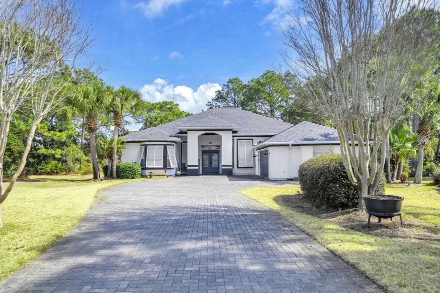 Set within the prestigious gated golf course enclave of Emerald Bay in Destin, this Mediterranean-inspired 3-bedroom, 2-bath residence with a versatile flex room offers an exceptional blend of privacy, sophistication, and resort-style living. Positioned at the end of a quiet cul-de-sac and bordered by a protected conservation area, the property delivers a serene, secluded setting just minutes from Destin's renowned beaches, dining, and shopping.

French doors open to an elegant formal living room, where soaring ceilings and a wall of sliding glass doors crowned by dramatic transom windows flood the space with natural light. These architectural details frame tranquil views of the private screened-in saltwater pool, creating a seamless indoor-outdoor connection. The adjacent family room, anchored by a gas fireplace, flows effortlessly to the covered back porch and pool terrace--ideal for refined entertaining or relaxed evenings outdoors. The primary suite occupies a private wing with direct pool access and a recently updated spa-inspired bath featuring a soaking tub set within a bay window with granite ledge, a custom glass-enclosed walk-in shower, and an expansive double vanity with generous storage.

The flex room offers exceptional versatility and can serve as a home office, media room, fitness space, or additional guest accommodations. Fresh neutral interior finishes enhance the home's refined aesthetic, while the oversized garage with built-in cabinetry and work surfaces adds exceptional functionality. A well-fed irrigation system supports lush landscaping, and storm shutters, storm doors, and a full-house generator provide peace of mind.

Residents of Emerald Bay enjoy an exclusive golf course lifestyle in one of Destin's most desirable communities--offering elevated coastal living just moments from the emerald waters of the Gulf.