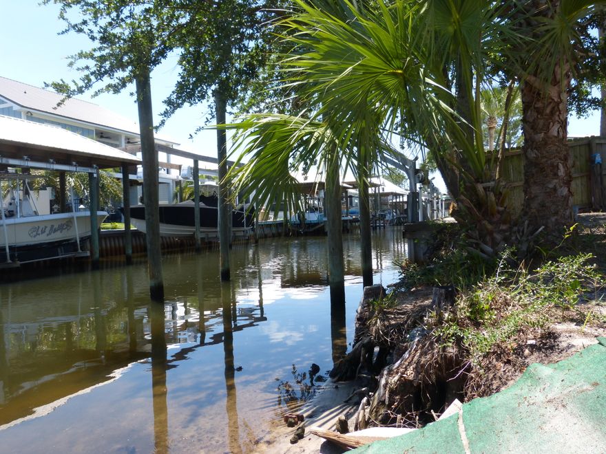 YOUR PRIVATE GATEWAY TO THE GULF IS HERE! This is the best-priced waterfront gem with Direct Gulf Access, look no more.  Immaculate & Refreshed: ''Fresh and Ready'' condition with updates throughout.  The Space: 3BR / 2BA + Den & Fireplace, Large Sun Filled Chef's Kitchen, Laundry Area all situated on a waterfront canal.  Outdoor Living: Huge screened porch & shade trees with gentle access to the water's edge, ample parking, RV's welcome.  Boater's Retreat: Deep canal for easy navigation to open water. We are open for offers, come see this well priced home of over 1500sf. 4 Dock pilings installed. Owner Financing Available. VA, FHA, and Conventional financing options are ready to go as well. Ask for our owner financing option, the monthly payment offered for principal and interest is under $2050/mo. You will be hard pressed to find a better home to buy. Call now, easy to show!