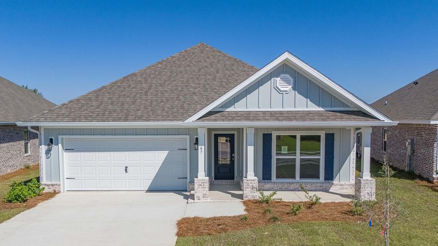 Welcome to the 47 Gray Owl Drive, a new home located at Owl's Head Farms, in Freeport, Florida. Step inside to a welcoming and open layout designed for comfortable living. The kitchen, complete with quartz countertops, Whirlpool stainless steel appliances, undermount single basin sink with a dedicated water filter faucet and a functional island, opens directly to the dining area and living room, creating a seamless space for entertaining and relaxation. The high 9' ceilings and additional tray ceilings in the living and primary bedroom create boosts the luxurious feel in this home. The owner's suite, tucked away at the back of the home, features a private bathroom with a walk-in shower and double vanity.