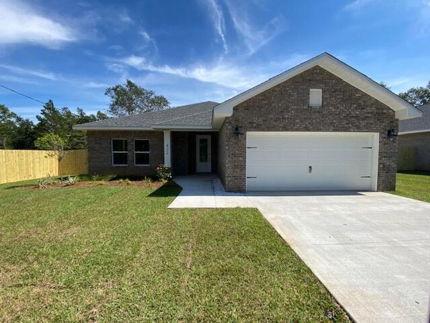 Step into effortless living with this stunning all-brick home ideally located just minutes from local bases, beautiful beaches, and everyday shopping. Designed with both style and functionality in mind, this home showcases high-end finishes and thoughtful upgrades throughout.

Inside, you'll find an upgraded entryway with a shoe bench and coat rack. Wood-look tile flooring flowing seamlessly through the main living areas - including the foyer, kitchen, bathrooms, and laundry room, offering both durability and modern appeal. The living room is elevated by a stylish alcove ceiling, creating added height and an open, inviting atmosphere.

The tucked-away kitchen is a true standout! Bright, modern and perfect for entertaining. It features quartz countertops, crisp white cabinetry, soft-close drawers, and a spacious breakfast bar accented with decorative pendant lighting, making it ideal for casual dining or hosting guests.

The primary suite offers a relaxing retreat with a generously sized bedroom and a beautifully appointed en-suite bathroom. Indulge in the comfort of dual walk-in closets, a tiled walk-in shower, and a separate soaking tub, perfect for relaxing after a long day.

Enjoy added convenience with a dedicated laundry room featuring a folding table for extra workspace, plus direct access to a spacious two-car garage.

Step outside to a covered back porch, ideal for relaxing or entertaining overlooking a fully fenced backyard that wraps around the home and features a convenient access gate. This property offers everything you need. Don't miss your opportunity to make it yours. Contact us today for a showing!