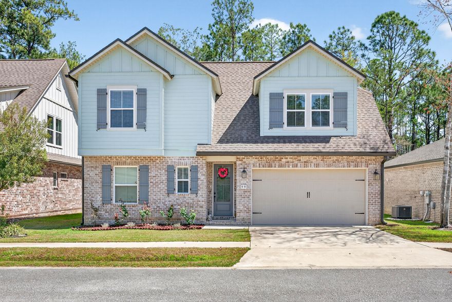 Welcome to this beautifully designed home featuring 4 bedrooms plus a versatile flex room and 2.5 bathrooms, offering comfort, style, and functionality for modern living. The full brick exterior, covered entry, and two-car garage create timeless curb appeal.

Inside, a stunning double-volume entry and living space fills the home with natural light and creates an open, airy feel. The open-concept layout seamlessly connects the kitchen, dining, and living areas--perfect for everyday living and entertaining. The kitchen features white cabinetry, a large quartz countertop, and a walk-in pantry.

The main-floor primary suite offers a peaceful retreat with a glass walk-in shower, double vanity, and walk-in closet, with laundry conveniently located on the same level.  Upstairs offers three additional bedrooms, a full bath, and a spacious loft. Enjoy a private wooded backyard, perfect for morning coffee or relaxing evenings.