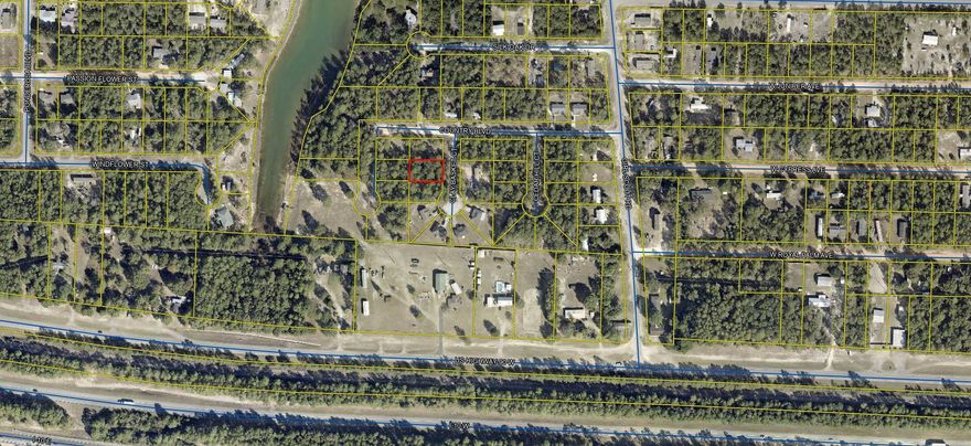 Wooded lot  80'x125' you can almost see Hwy 90 W in DeFuniak.  Located off Girl Scout Road.  
City water available, tap fee not paid.  Several new homes being built in this area.  Mobile homes allowed.