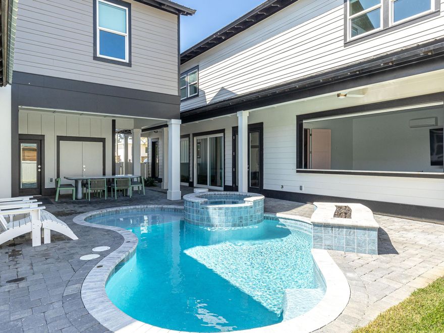 A rare offering along 30A, this newer-construction 10-bedroom residence is designed for scale, comfort, and effortless gathering, just moments from the beach. Thoughtfully laid out across a main home and private carriage house, the property accommodates up to 22 guests with ease while maintaining a sense of privacy and flow that feels both refined and relaxed.

Inside the main home, five king suites, two queen suites, and a dedicated bunk room with four twin beds are each paired with their own ensuite baths, creating a seamless experience for guests and owners alike. Two of the king suites are positioned on the ground floor for convenience, while a half bath with direct pool access enhances the home's indoor-outdoor rhythm. The open living, dining, and kitchen spaces are designed to bring everyone together, whether for quiet mornings or lively evenings.

The outdoor setting carries that same intention. A private pool and spa serve as the centerpiece, framed by generous lounging areas and a built-in fire pit that invites conversation long after sunset. Covered spaces extend the living area, offering shade and comfort throughout the day. 

Complementing the main home, the carriage house introduces an additional layer of versatility. Two queen suites sit above, while the ground level features a spacious lounge with an oversized 83-inch television, a mini fridge, and extra dining space. A connected game room opens through a roll-up door to an indoor-outdoor bar, creating an ideal setting for entertaining with ping pong, darts, and casual seating designed for long afternoons that drift into evening.

Positioned within a desirable stretch of 30A, the home also benefits from nearby public beach access at Gulfview Heights just moments away. For those drawn to nature, the nearby Longleaf Trail offers 13 miles of scenic pathways through Point Washington, adding another dimension to the coastal experience.