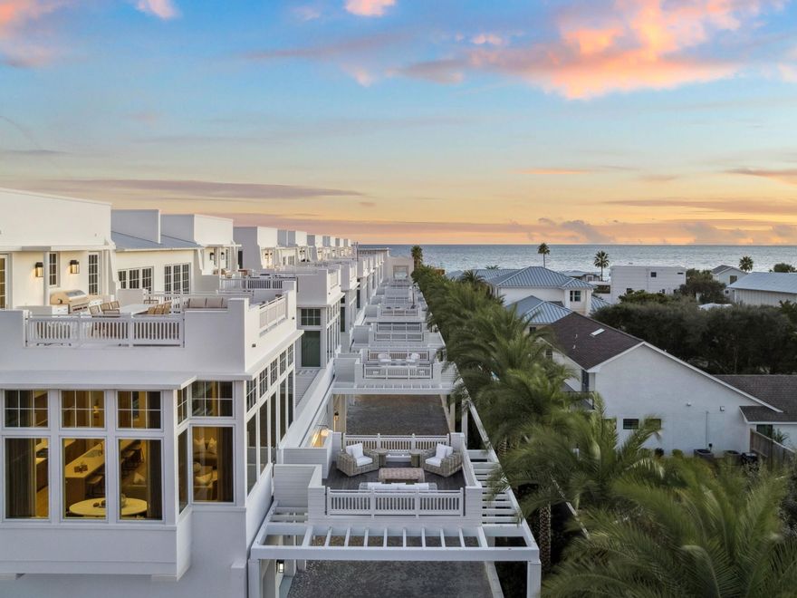 Positioned along the coveted south side of 30A, this furnished Kaiya villa showcases sweeping Gulf views from multiple levels and sits on one of only twelve homesites granted this premier location. Thoughtfully designed across three stories, it blends modern coastal architecture with a calm, indoor-outdoor flow.

A private entry courtyard opens to a gracious foyer with elevator access to all floors. The first level features two beautifully finished guest suites, each with an ensuite bath, along with a two-car garage for ease and security. The second level serves as the main gathering space, defined by soaring ceilings, curated designer finishes, and walls of glass that frame sweeping Gulf vistas. The chef's kitchen offers custom cabinetry, premium appliances, and a refined island that flows into the dining area and covered terrace. A tranquil bedroom suite with a spa-inspired bath and its own private outdoor retreat completes this floor.

The top level is designed for elevated coastal living, highlighted by a stunning rooftop terrace with panoramic Gulf views and a summer kitchen ideal for open-air dining. A second luxurious suite anchors this level, featuring a private balcony, an elegant ensuite bath, and a generous dressing area, complemented by a media lounge.

With its exclusive south-side positioning, compelling views, and fully furnished presentation, this Kaiya villa stands among the most impressive offerings along 30A.