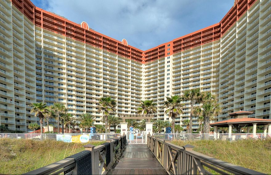 Welcome to Shores of Panama unit #1004, a beautifully positioned 2 Bedroom + Bunk, 3 Full Bath Gulf-front condo designed for both personal enjoyment and strong rental appeal. This highly desirable ''B'' floor plan offers sweeping views overlooking the lagoon-style pool and stretching down the breathtaking coastline of Panama City Beach. Positioned on the west side of the tower on the 10th floor, this condo captures stunning views from your private balcony. The condo conveys fully furnished and rental-ready, making it an effortless investment opportunity or turnkey beach retreat. This unit also includes one deeded parking space. The smart layout--with two true bedrooms, a bunk area, and three full bathrooms--maximizes occupancy and comfort, a key feature for vacation rentals. Shores of Panama is home to the largest Gulf-front lagoon pool in Panama City Beach, with its spectacular 14,000+ sq ft zero-entry lagoon pool with palm-lined islands, fountains, and expansive hot tub. tropical palm islands, fountains, and an oversized hot tub--all just steps from exclusive beachfront access. Owners and guests also enjoy: Indoor heated pool and hot tub, 24-hour fitness center, Seasonal poolside Tiki bar, Covered parking, and On-site security. The location is unbeatable--walk next door to Pineapple Willy's for beachfront dining or cross the street to Laketown Wharf for multiple dining options including The Wharf Buffet, Juan Taco, and LuLu's Bar & Restaurant. Shopping, entertainment, and attractions are all within easy reach. If you're looking for a well-positioned Gulf-front condo with proven rental appeal and unbeatable amenities--this is a standout opportunity. With exterior renovations scheduled to enhance curb appeal and long-term value, this is a strategic opportunity to secure this wonderful gulf front condo--ideal as a personal retreat, income powerhouse, or both. All information and HOA details are believed accurate but should be verified by buyers if important.