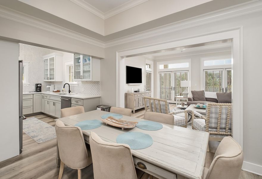 Set within the vibrant Town Center district of WaterColor and overlooking scenic 30A, this beautifully renovated 2-bedroom, 2-bath condominium with a dedicated bunk room offers an exceptional blend of sophisticated coastal living and unmatched convenience. Ideally located just moments from the acclaimed WaterColor Beach Club, the boathouse on Western Lake, Cerulean Park, and an array of boutique shops and restaurants, the residence presents an outstanding opportunity for both personal enjoyment and investment potential. Thoughtfully redesigned with a refined coastal aesthetic, the interiors feature extensive upgrades throughout, including custom wall detailing, updated flooring, designer cabinetry, stone countertops, statement lighting, premium plumbing fixtures, and a fully refreshed furnishing and décor package. Positioned on a single level within the second floor of the building, the residence is easily accessible via elevator or staircase and offers a comfortable, open-concept layout designed for effortless entertaining.

Natural light fills the spacious living and dining areas, which extend seamlessly onto an expansive wraparound porch as an inviting outdoor retreat ideal for dining, lounging, or enjoying the coastal atmosphere after a day on the beach. The primary suite offers generous proportions and a private ensuite bath, while the guest accommodations include an additional bedroom, a charming bunk space, and a large secondary bath complete with laundry area. The beautifully updated kitchen combines functionality with elevated design, creating a space equally suited for casual mornings or hosting guests.