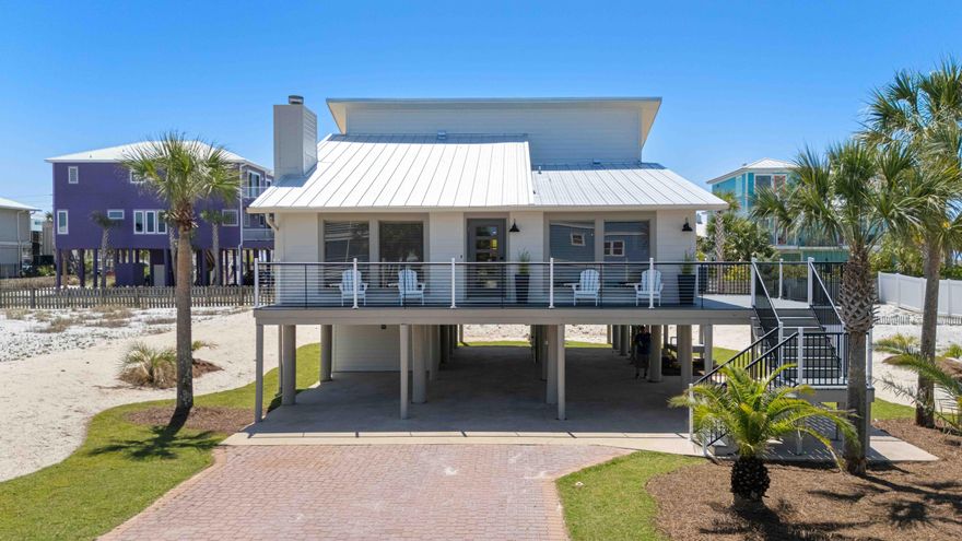Fully renovated and not your average beach rental, this turnkey furnished 3-bedroom, 2-bath home on desirable White Sands Blvd offers charm, quality upgrades, and excellent short-term rental investment potential just one block from public beach access and minutes to the Navarre Beach Pier, restaurants, and local favorites. From the moment you arrive, the home showcases outstanding curb appeal and coastal character, along with major recent improvements including a brand-new metal roof, new HVAC system, new wrap around large deck, all new exterior doors, and freshly maintained and painted Hardie board siding.Inside, enjoy luxury vinyl flooring throughout and a bright, inviting layout filled with natural light. The kitchen features beautiful onyx countertops and opens to an outdoor area that is perfect for grilling and dining while enjoying Navarre's incredible sunset skies. The first level includes two bedrooms and a fully renovated full bathroom with updated finishes throughout. A striking wrought iron staircase leads to the oversized primary suite featuring abundant natural light and private patio doors opening to a deck with a peek view of the Gulf. The primary bathroom is beautifully designed and truly exceptional.
Additional bonus space includes a 192 sq ft finished attic, ideal for a playroom, office, or flex space (not included in heated/cooled square footage). Outdoor living continues with a new sun deck, plus valuable covered parking, ground-level storage for beach gear, and space for a golf cart. The property also benefits from a larger-than-typical lot with new sod and sprinkler system, water views, and strong rental appeal.
Whether you're searching for a primary residence, second home, or income-producing beach property, this White Sands Blvd opportunity stands out as a rare find on Navarre Beach.