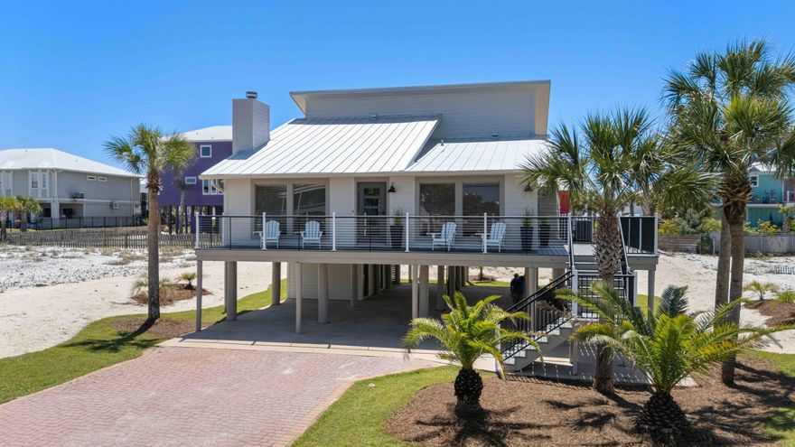 Fully renovated and not your average beach rental, this turnkey furnished 3-bedroom, 2-bath home on desirable White Sands Blvd offers charm, quality upgrades, and excellent short-term rental investment potential just one blocks from public beach access and minutes to the Navarre Beach Pier, restaurants, and local favorites. From the moment you arrive, the home showcases outstanding curb appeal and coastal character, along with major recent improvements including a brand-new metal roof, new HVAC system, new wrap around large deck, all new exterior doors, and freshly maintained and painted Hardie board siding.Inside, enjoy luxury vinyl flooring throughout and a bright, inviting layout filled with natural light. The kitchen features beautiful onyx countertops and opens to an outdoor area that is perfect for grilling and dining while enjoying Navarre's incredible sunset skies. The first level includes two bedrooms and a fully renovated full bathroom with updated finishes throughout. A striking wrought iron staircase leads to the oversized primary suite featuring abundant natural light and private patio doors opening to a deck with a peek view of the Gulf. The primary bathroom is beautifully design and truly exceptional.
Additional bonus space includes a 192 sq ft finished attic, ideal for a playroom, office, or flex space (not included in heated/cooled square footage). Outdoor living continues with a new sun deck, plus valuable covered parking, ground-level storage for beach gear, and space for a golf cart. The property also benefits from a larger-than-typical lot with new sod and sprinkler system, water views, and strong rental appeal.
Whether you're searching for a primary residence, second home, or income-producing beach property, this White Sands Blvd opportunity stands out as a rare find on Navarre Beach.