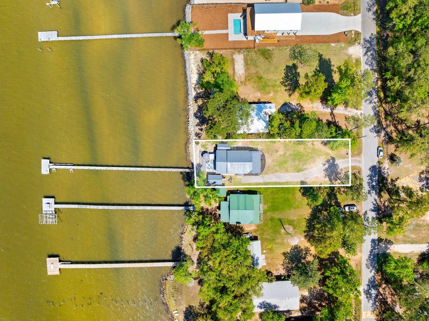Discover waterfront living in Freeport, where peaceful bayfront views, a new dock, and no HOA create the ideal coastal retreat. 

Build new or move right into the existing charming 2-bedroom, 2-bathroom home with 60 feet of bay frontage while you design your dream home.

Enjoy direct access to the water and the relaxed lifestyle buyers are searching for along the Emerald Coast. 

A new roof installed in 2024 adds peace of mind, while the prime location places you just minutes from 30A beaches, shopping, dining, and everyday conveniences.