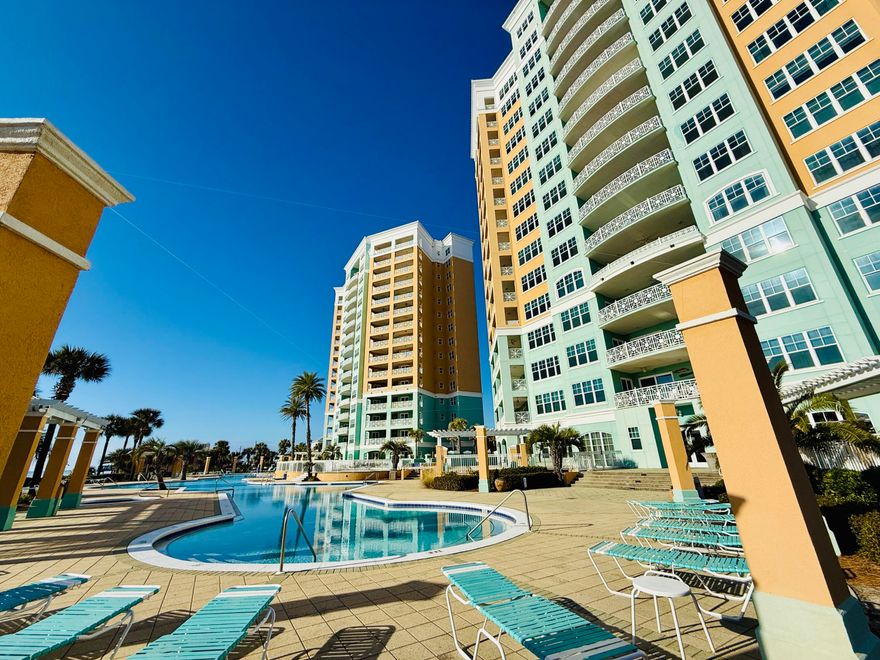 GULF-FRONT PENTHOUSE + EXPANSIVE TERRACE WITH PRIVATE POOL!
Welcome to 7505 Thomas Dr, PH 121G, a first-floor penthouse at En Soleil in South of Grand Lagoon on Panama City Beach, offering panoramic Gulf views, 5 bedrooms, 4 en-suite baths, and 3,079 sq ft. Fully furnished, this residence features a 1,700 sq ft private terrace ideal for indoor/outdoor living, with a 16x10 heated pool and outdoor kitchen. The split floor plan provides privacy, while floor-to-ceiling windows fill the space with natural light. Includes deeded garage parking space and a deeded storage room. Strong rental potential with projections up to $150,000 annually and resort-style amenities make this a standout investment or second home, offering a total of 4,779 sq ft of coastal living along the Emerald Coast! Enjoy expansive Emerald Coast views from the oversized private terrace--perfect for morning coffee or sunset evenings. The newly resurfaced heated pool anchors the outdoor living space, complemented by an outdoor kitchen with grill and partially covered lounge and dining areas designed for year-round entertaining and relaxation.

Recent upgrades include Cat-5 hurricane-rated windows and sliding glass doors (2023), two new HVAC systems (2024), updated baseboards and crown molding, new blinds throughout, exterior patio tile border, freshly painted terrace privacy fence, upgraded pendant lighting, a new gas fireplace, seven new smart TVs, and an additional refrigerator in the private storage room located just outside the front door.

Inside, the open-concept kitchen features an eat-in bar, new refrigerator, wine refrigerator, custom cabinetry, granite countertops, and two dining areas, creating an ideal flow for gatherings. The open layout seamlessly connects the living, dining, and kitchen spaces, supporting both everyday comfort and entertaining.

En Soleil features two 15-story towers with only 88 total units and just 2-3 residences per floor, offering a quiet and private setting. This gated community includes 24/7 security, private beach access with seasonal chair service, two beachfront hot tubs, resort-style pools, a fitness center, conference room, and underground garage parking. This unit includes a deeded garage parking space with elevator access.

Conveniently located near world-class golf, sport fishing, fine dining, and boutique shopping, En Soleil offers over 6,500 square feet of swimming pools, waterfall features, and 450 feet of private sugar-sand beach. From the pool deck, follow the private walkway directly to the Gulf!

Don't miss this rare opportunity to own a penthouse along The Emerald Coast - Schedule your private showing today!