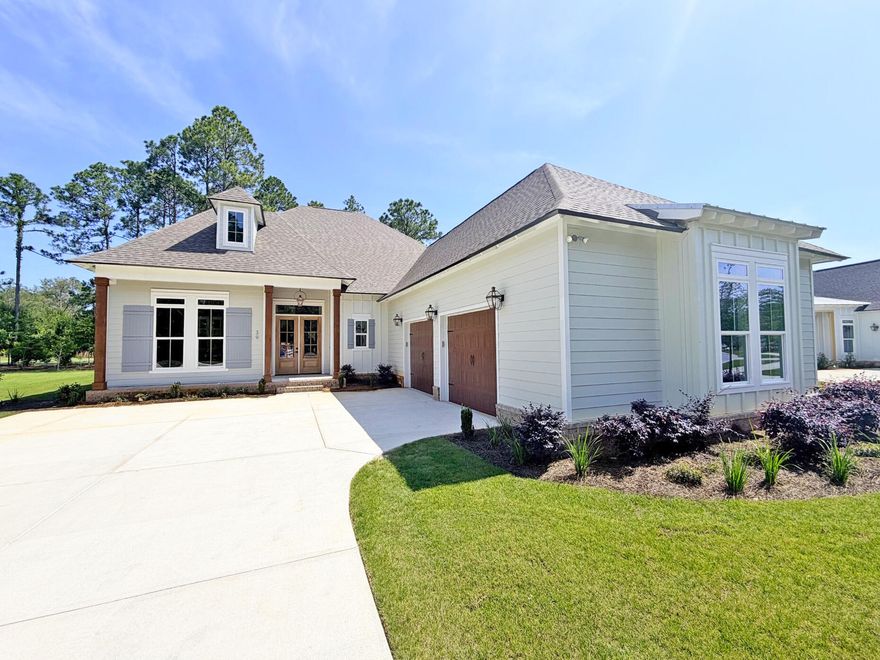 Awesome builder rate! Restrictions apply. 

The MARLEY II G in Steamboat Landing at Hammock Bay community offers a 3BR/2.5BA, open design with flex space. Upgrades added (list attached). Special Features: double vanity, garden tub, separate custom tiled shower, and walk-in closet in master bath, double vanity in 2nd bath, kitchen island, walk-in butlers pantry, boot bench at garage entry, covered porches, side entry garage, undermount sinks, ventless gas fireplace, LED lighting, framed mirrors in all baths, landscaping, architectural 30-year shingles, flood lights, wooden shutters, and more! Energy Efficient Features: tankless gas water heater, gas kitchen appliance package, above range pot filler, vinyl low E windows, and more! Energy Star Partner. Introduction Salt & Pine Luxury Homes, a premium division of DSLD Homes.