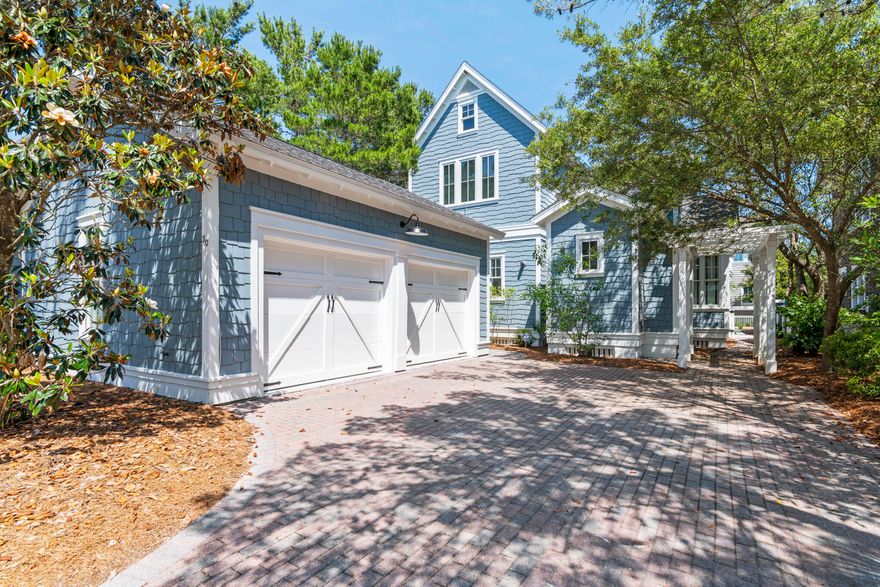 Welcome to 30 North Shingle Lane, a beautifully designed 4-bedroom, 3.5-bathroom home in the heart of WaterSound Beach, featuring a new roof, private pool and packed with style, charm, and modern comforts. Forget cookie-cutter architecture, this Gulf-blue shingle-clad cottage behind a white picket fence has instant curb appeal and classic WaterSound character. A paved driveway leads to a spacious two-car garage and a welcoming footpath to the front porch. Inside, the home features thoughtfully updated décor, stylish lighting, and curated artwork, along with traditional wainscoting, gleaming wood floors, and a cozy fireplace—perfect for family gatherings or relaxed entertaining. he open-concept layout flows seamlessly from the dining area to the gourmet kitchen, equipped with white Shaker-style cabinets, black granite countertops, stainless steel KitchenAid appliances, and a Sub-Zero refrigerator. A central butcher-block island adds both prep space and charm. The spacious first-floor primary suite includes a soaking tub, walk-in shower, and double vanity, while the additional bedrooms upstairs provide comfort and style for guests or family. Screened-in porches on both levels and a landscaped backyard with cozy seating create multiple outdoor living spaces to enjoy the Florida sunshine. The private pool is a standout feature, perfect for cooling off or unwinding after a beach day. This home is ideally located inside the main gates of WaterSound, just a short walk or bike ride to the private beach access, the Dunesider pool, and all of WaterSound's resort-style amenities--including a fitness center with sauna, dog park, children's playground, Puttering Park, Linear Park, and seven miles of scenic boardwalks and walking trails. Don't miss this opportunity to own one of the most charming homes in WaterSound--complete with your own private pool.