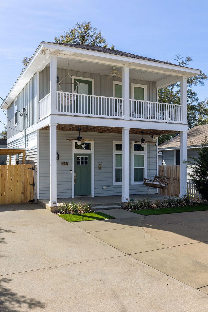 **Back on the market at no fault to seller, now is your chance!** She's a whole VIBE; not your average cookie cutter. This one feels different. Inside, bold, rich tones meet bright natural light, creating a space that feels both open and cozy. Soaring ceilings and an airy layout keep it light and inviting, while deep accent walls, warm wood details, and modern finishes add depth and character. It's just as perfect for slow mornings with coffee as it is for hosting friends on a Friday night. The kitchen is clean and modern with stainless appliances, crisp cabinetry, and a statement island that anchors the room. The custom bar nook adds just the right touch of personality; intimate, functional, and ready for happy hour. Upstairs, the bedrooms feel peaceful and tucked away, offering a quiet  retreat while still maintaining the home's stylish edge. But the real magic? The outdoor space. The backyard is thoughtfully designed for both relaxation and gathering. Artificial turf zones, natural rock beds, and string lights create a laid-back, low-maintenance oasis. There's room for fire pit nights, picnic-table dinners, and space to unwind under the trees. The covered patio extends your living space outdoors giving you the ideal spot for game day grill outs. Now let's talk functionality...long driveway with ample off-street parking, covered parking area for boat or vehicle storage, and a dedicated covered structure ideal for paddle boards, kayaks, bikes, and all other outdoor toys, plus it's fully fenced for privacy. BEST part? You're only 3 minutes from downtown Pensacola. This home doesn't just look good, it feels good. She's stylish, low maintenance, in a dream location, and designed for real life. Come swoon over her!