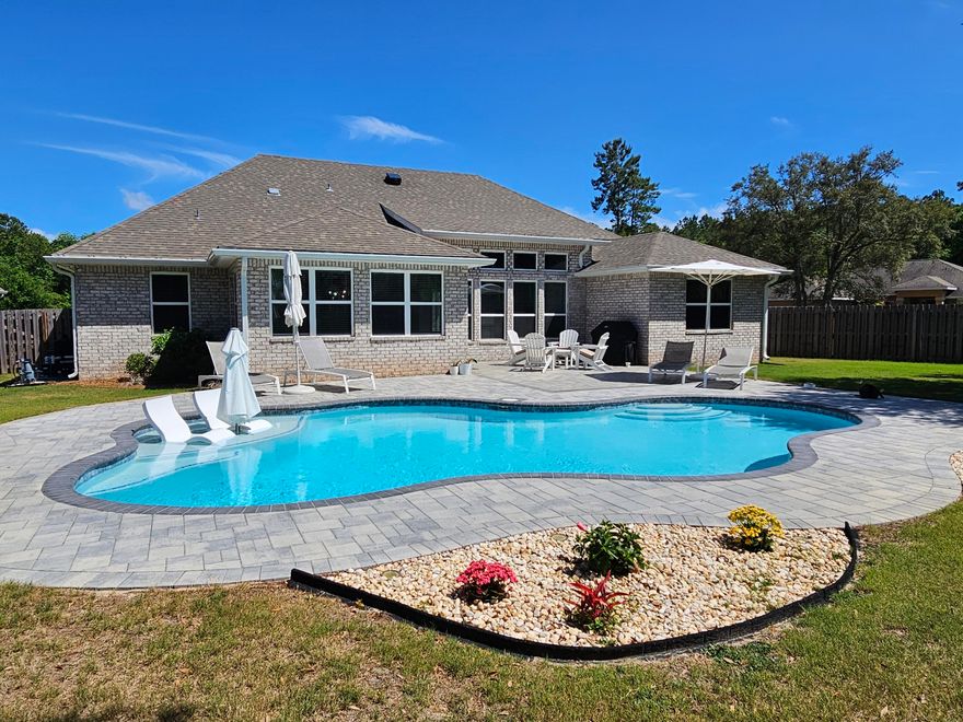 Under Contract Accepting Backup Offers. Welcome to The Season's Retreat, effortless indoor-outdoor living in the heart of Hammock Bay. Situated on a corner lot, this home offers 5-bedrooms, 3-full-baths, and an additional flex living area currently an office. Step outside to your fully fenced backyard oasis, featuring a private pool and ample yard space-ideal for adding a fire pit, putting green, outdoor kitchen, or even parking for recreational toys. This home offers true Florida style living year-round. Inside, the spacious living room offers beamed ceilings, beautiful window-wall overlooking the pool, creating cozy feel and open atmosphere ideal for entertaining or quiet evenings at home.  .....
Gourmet kitchen offers large quartz top island, gas range and plenty of cabinets. Stylish Wet bar with refrigerator an
Stylish Wet bar with refrigerator and open shelving is perfect for setting up your coffee nook or cocktail bar. 
An additional dining area with a tray ceilings and large windows provides flexible space for gatherings, hobbies, or play, while the 5th bedroom used as an office with beautiful French doors is perfect for work, home gym or a study.
The home offers perfectly-designed layout where every inch is used for comfort and functionality. Built in 2022 by Holiday Builders this one story brick home is the perfect primary or vacation home residence here in the Sunshine State.
Only 1 mile to the Hammock Bay community center, under 20 miles to the white-sand beaches of Walton county this home offers perfect location and convenience.
Living in Hammock Bay means embracing a resort- lifestyle. 6000 SF clubhouse with a private movie theater, catering kitchen, dining space, playroom and a lounge area overlooking the lake and pool patio combined with multiple workout facilities, lap pool, 4 additional pools, playground, courts for pickleball, tennis and basketball..Known for its natural beauty, walkability, and vibrant sense of community, the neighborhood offers miles of scenic walking, jogging, and biking trails with preserved green areas, lakes and more... there's something for every age and interest.

At the heart of the community, a lively Town Center hosts regular events such as farmers markets, food trucks, concerts, and seasonal gatherings creating fun opportunities to connect with neighbors and friends. Residents have access to highly rated local schools, Freeport Sports complex neighboring the community and the convenient location just minutes from shopping and dining in Freeport and easy drive to 30A, Destin, and Sandestin.

Whether you're raising a family, working from home, or seeking a cozy yet active community, this Hammock Bay home offers the space and setting to truly enjoy where you live. 
Schedule your private tour today!

Buyer to verify all information. CDD fee applies.