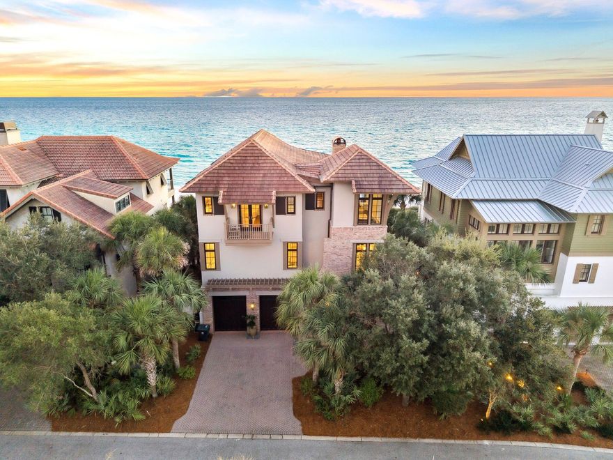 Perched atop manicured dunes within the exclusive gates of The Retreat, this stunning, artfully curated estate redefines coastal luxury. The Retreat welcomes residents with lush greenery, generous homesites, and the newly reimagined Beach Club—an amenity unmatched on 30A's coveted west end. At 131 W. St. Lucia Lane, timeless architecture meets modern sophistication. Designed by the late Dawn Thurber and brought to life by Davis Dunn Construction, this home stands as a testament to artistry and craftsmanship.Built entirely of concrete, the home exudes enduring quality, while a heated gulf-front pool, summer kitchen, and fire pit create an idyllic space for relaxation and entertaining.Inside, thoughtful textures and curated details blend heritage with contemporary design. The first level includes a gulf-view guest suite, flex room, and two-car garage with elevator access. The second floor unfolds into a stunning open-concept living area featuring formal dining, a chef's kitchen with Wolf and Sub-Zero appliances, reclaimed maple flooring, and dual seating spaces anchored by a brick fireplace. Expansive glass doors open to a covered terrace framing endless views of the Gulf. The first level features a gulf-view guest suite, a flex room, and a two-car garage with elevator access. The second floor unfolds into a stunning open-concept living area, featuring a formal dining space, a chef's kitchen with Wolf and Sub-Zero appliances, reclaimed maple flooring, and dual seating spaces anchored by a brick fireplace. Expansive glass doors open to a covered porch framing endless views of the gulf. A guest suite with expansive windows featuring gulf views and media room with an adjoining bath completes this level. The third floor offers an exquisite primary suite with sweeping gulf vistas and a marble-clad bath that defines indulgence. Two additional bedrooms are adjoined by an en suite bath with the western suite capturing panoramic views of both the Gulf of America and Draper Lake.  131 W. St. Lucia Lane is more than a home - it's a refined coastal sanctuary, perfectly blending elegance, craftsmanship, and breathtaking natural beauty.