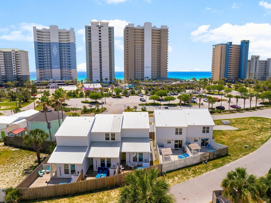 * 5 Doors from the Shore - Invest in Style & Income!* Investor's dream in Panama City Beach! This exceptional turnkey rental package includes a beautifully designed triplex and duplex, sold together and fully furnished for immediate income generation. Built in 2020, the triplex offers over 4,000 square feet of thoughtfully planned space, featuring 9 bedrooms and 9 bathrooms across three individually themed units: The Beach Cabana, The Groovy Shack, and Welcome to Paradise. Each unit is uniquely styled to provide guests with a one-of-a-kind, Instagram-worthy experience, complete with private entrances, vibrant exterior doors, and modern coastal finishes that capture the laid-back beach vibe. The adjoining duplex adds another 2,800 square feet of living space, offering 4 bedrooms and six  bathrooms across two distinct units: The Surf House and The Tropical House. Like the triplex, these units continue the playful, curated design aesthetic and are optimized for maximum guest appeal and rental performance. Every unit has been thoughtfully furnished and is fully equipped, making this a true plug-and-play investment opportunity. Guests will love the short walk to the Gulf, where they can enjoy white sandy beaches and turquoise watersmaking these rentals even more attractive in Panama City Beach's thriving vacation market. With strong rental history and impressive income (figures available upon request), this property is already a high-performing asset with even more room to grow. Plans are in place for a 3-bedroom townhouse to be added on the west side of the lot, offering future expansion potential and additional income opportunities. Located just minutes from popular dining, shopping, and entertainment, this property package delivers the perfect combination of location, lifestyle, and long-term value. Whether you're looking to expand your portfolio or break into the short-term rental space, this opportunity checks all the boxes.