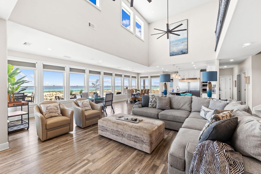 Welcome to 'Endless Summer', an immaculate, fully renovated beach front home that provides a great opportunity for home ownership close to the protected Gulf Islands National Seashore! Live and lounge with friends and family in a comfortable, laid-back atmosphere rising above 97 feet of uncrowded Navarre Beach!  Kick off your flip flops, stretch out and soak up the fun!  7439 Gulf Blvd creates a vacation retreat sleeping 20 and comprising of 6 bedrooms plus a bunk room as well as 4.5 bathrooms.  Upon entering the home, azure gulf waters unfold before your eyes and the open floor plan with kitchen marrying the dining and large living room assures you this home is designed for family and friends to gather and play at the beach. The expansive living room is flooded with natural light and boasts a wall of windows and soaring ceilings. Cooking is a delight in this well-appointed, fully renovated kitchen with casual island seating. Enjoy salty gulf breezes on the new deck spanning the rear of the home overlooking the white sandy beaches. Beautiful, well done renovation includes the creation of a new bedroom, new bathrooms and an owners closet as well as a myriad of updates and improvements including new roof, interior doors, flooring throughout, hot water heater outside deck and attic insulation as well as interior and exterior painting, updated baths and more! Additional exterior enhancements are currently underway, including the installation of a new brick paver driveway projected for completion by May 15, 2026. The Seller is also actively finalizing a professional landscape and irrigation plan to further enhance the property's curb appeal. "Endless Summer" is being offered fully furnished. For the adventurous, enjoy excursions as Navarre Beach is nestled perfectly between Destin and Pensacola for brief pleasure trips to discover some of the finest in casual and fine dining, shopping, and entertainment on the Emerald Coast. The Navarre Beach Pier, the longest pier on the Gulf coast, is nearby where you can enjoy fishing, boat watching, or gazing at the views of the Gulf Islands National Seashore. Eight miles of undeveloped pristine shoreline beckons you to explore the beach. We invite you to make an appointment to experience "Endless Summer" at 7439 Gulf Blvd in Navarre Beach.