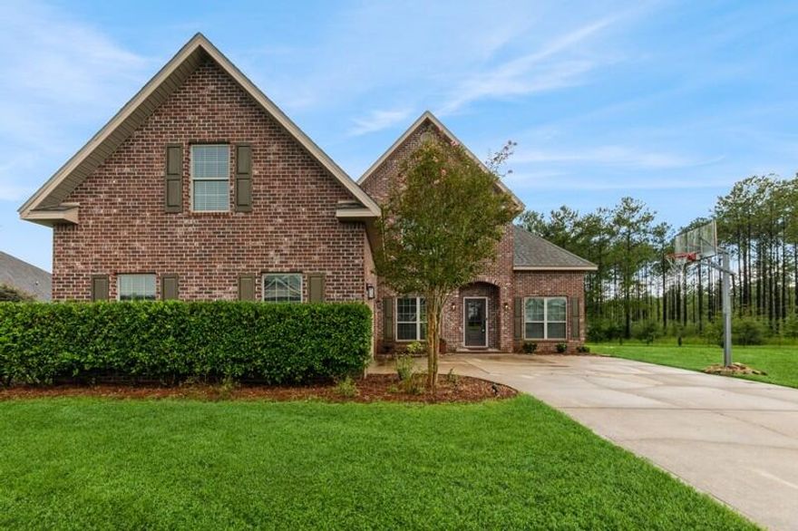 NEW ROOF March 2026, VA APPRAISED FEB 2026 at $485,000. Spacious 5BR/3.5BA traditional-style home in desirable North Crestview on a 0.56-acre lot closest home to Garden City Park, visible from your front door which has new playgrounds! This two-story gem features a formal dining room, office, and media room. Kitchen includes island, stainless appliances, and overlooks the family room with wood-burning fireplace. Rustic wood flooring throughout. Master suite offers trey ceilings, walk-in closet, garden tub, and separate shower. Upstairs: 2BRs, full bath, media room. Enjoy the brick patio with fireplace, mature trees, and built-in basketball hoop. Extras: 2 AC units, 2 walk-in pantries, built-in bench, low HOA ($200/yr), public water, septic, electric, fiber internet