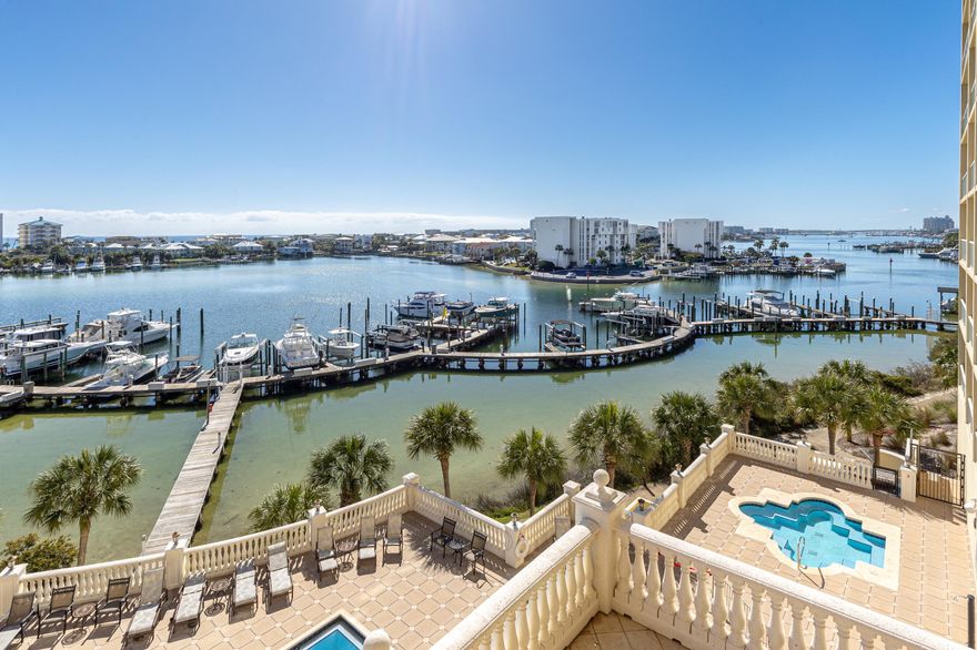 Perched on a 35-foot bluff above the iconic Destin Harbor, Marbella offers refined waterfront living in one of the area's most prestigious settings. This elegant 3-bedroom residence also includes a private office that can easily serve as a fourth bedroom. A spacious veranda captures sweeping views of the marina, sparkling harbor, resort-style pool, and the Gulf beyond. Inside, the thoughtfully designed floor plan features a gourmet kitchen with granite countertops, stainless steel appliances, abundant storage, and a gas fireplace anchoring the living and dining space. Marbella owners enjoy two deeded parking spaces, a private storage unit, and exceptional amenities including a professionally managed 58-slip marina, waterfront pool, fitness center, clubhouse, and stunning harborfront lobby.