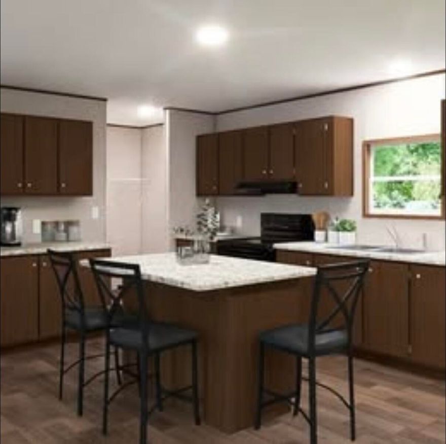 If you've been dreaming of your own little piece of heaven, this brand-new 2026 manufactured home is it. Offering 4 bedrooms, 2 bathrooms, and 1,971 square ft, this home sits on approx an acre in a beautiful wooded setting with a cleared, level homesite. Inside, you'll love the open layout with two living areas and a kitchen with island that flows into the main spaces. The split bedroom design offers a private primary suite, while the additional bedrooms are on the opposite side. Enjoy that down-home country feel while being just a short drive to the beach and close to Pensacola, Eglin, Duke Field, and Whiting Field. Pics are taken from the manufactures advertisement video of home. Home in to be delivered mid to late April.